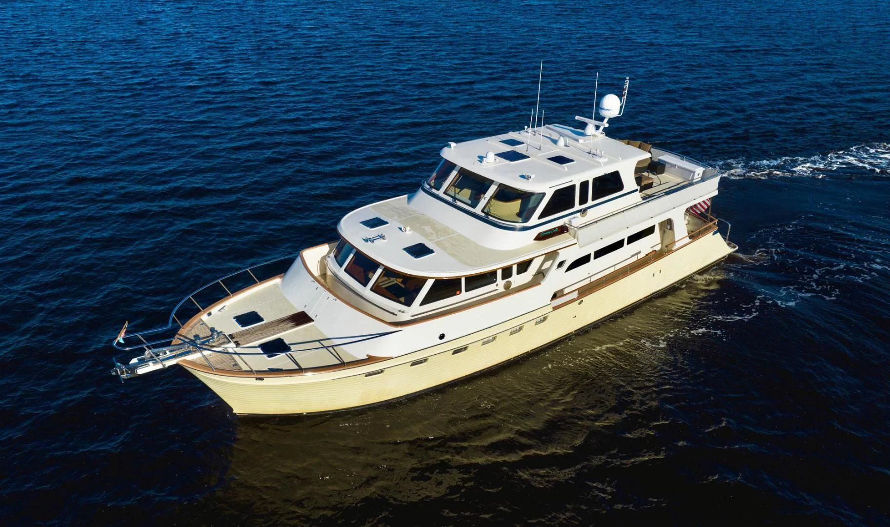 a white boat on the water aboard SOMEDAY CAME Yacht for Sale