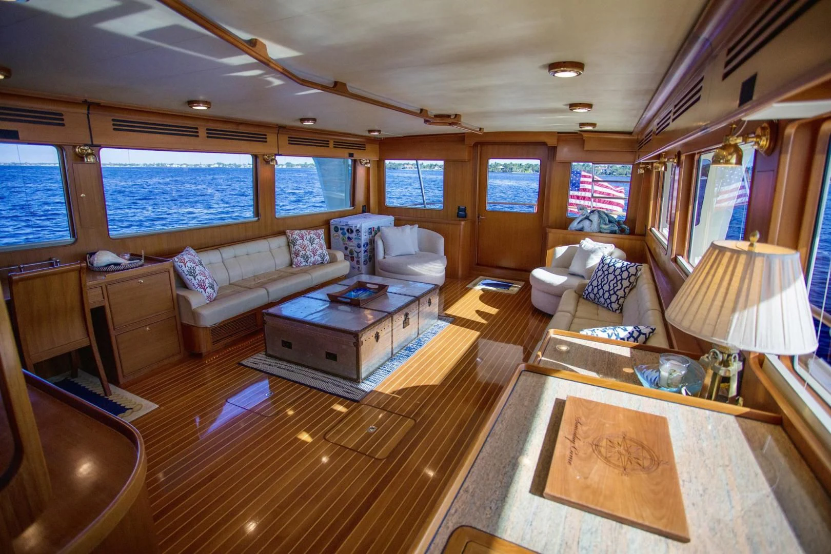 a living room with a large window aboard SOMEDAY CAME Yacht for Sale