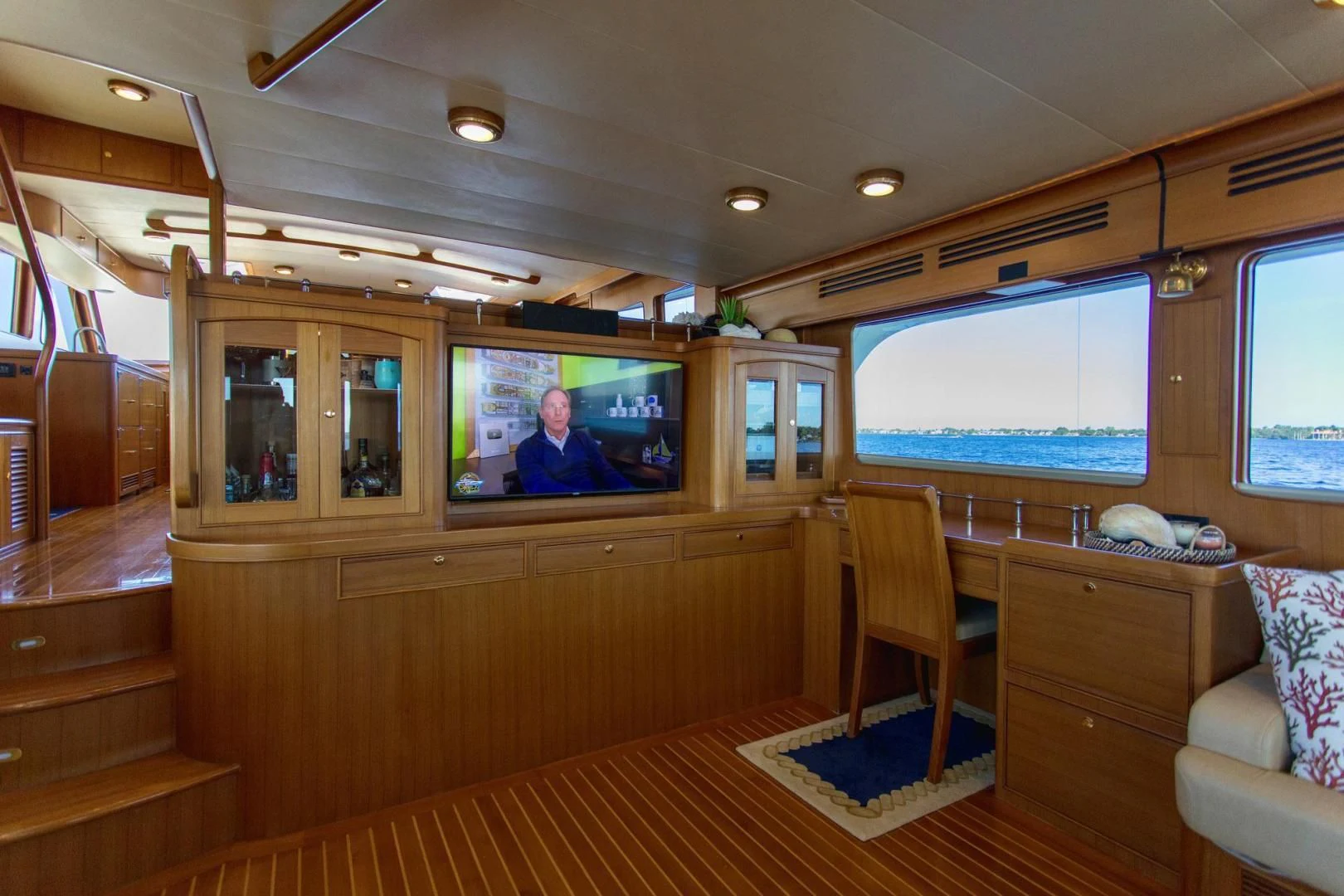 a cabin with a tv and furniture aboard SOMEDAY CAME Yacht for Sale
