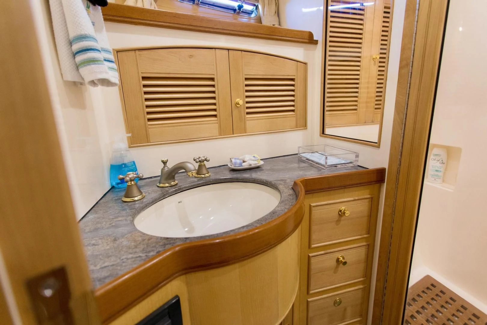 a bathroom with a sink and cabinets aboard SOMEDAY CAME Yacht for Sale