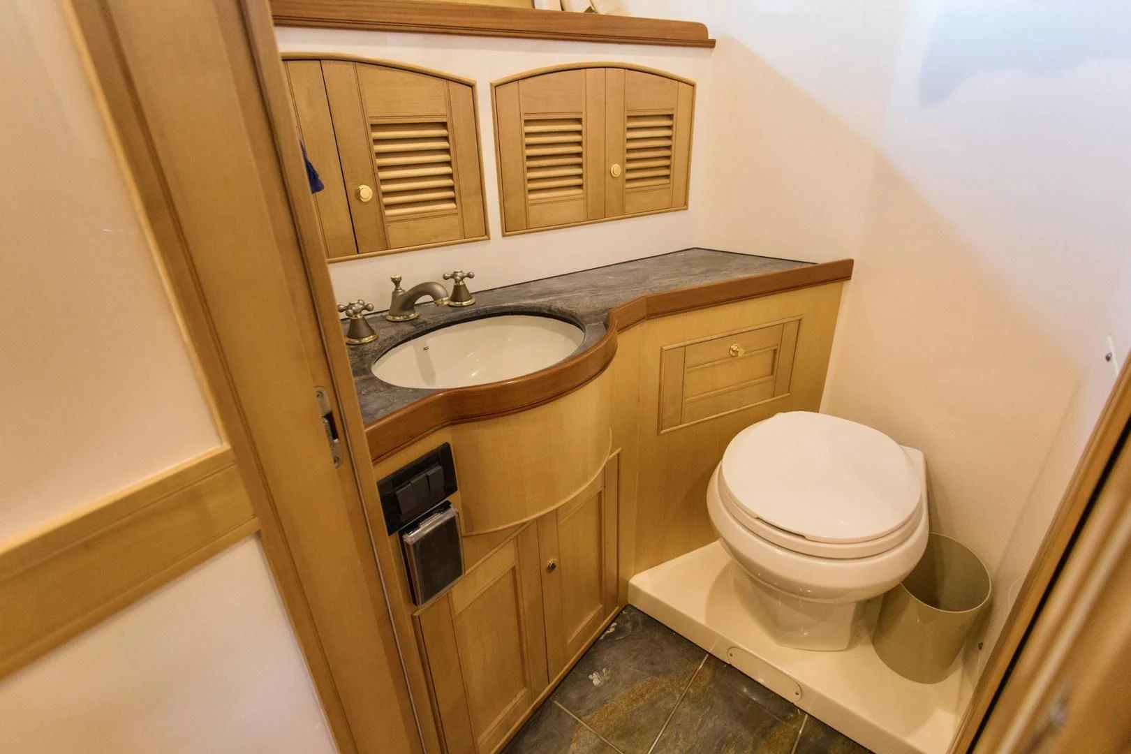 a bathroom with a sink and toilet aboard SOMEDAY CAME Yacht for Sale