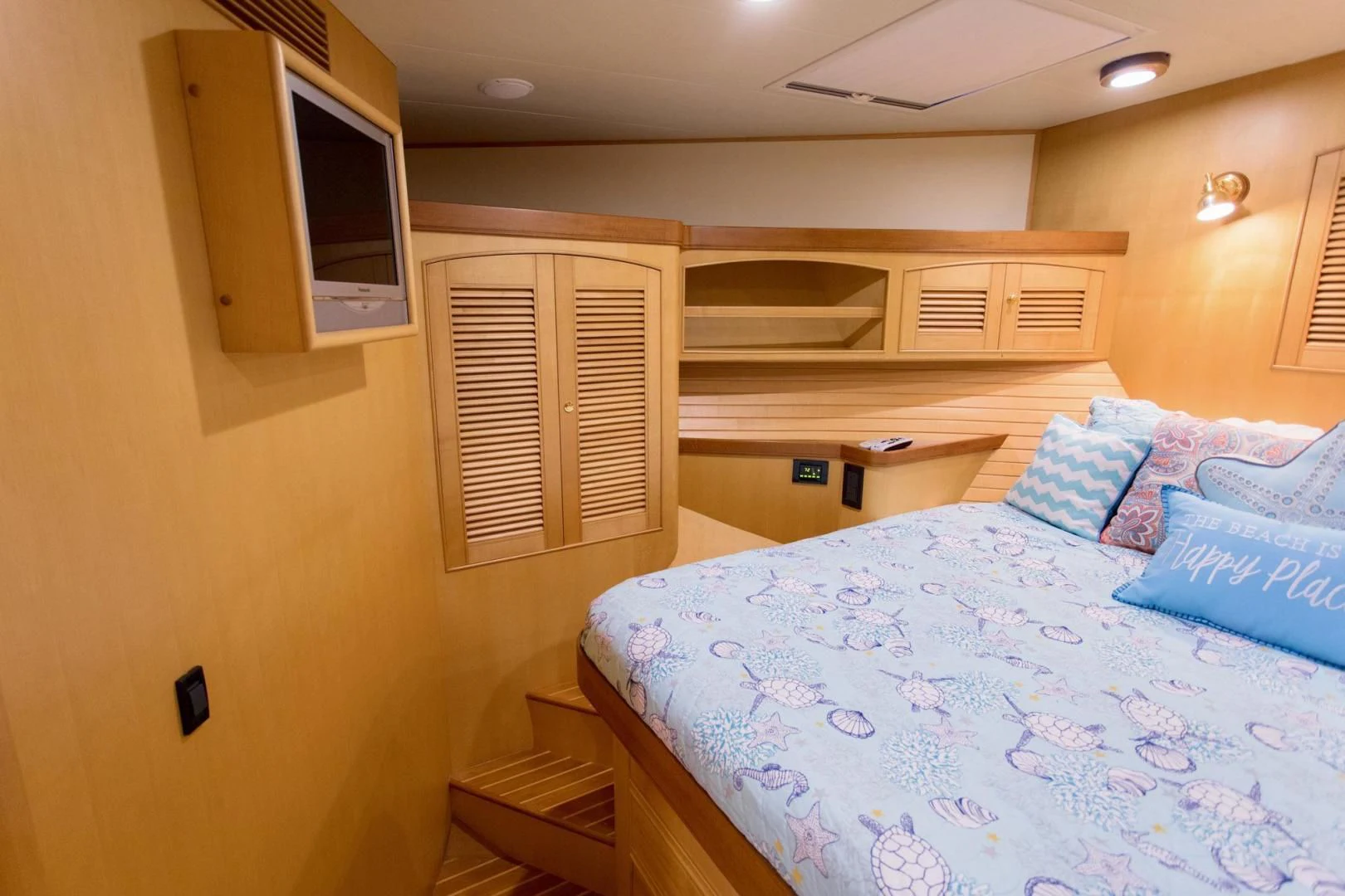 a bedroom with a bed and a television aboard SOMEDAY CAME Yacht for Sale