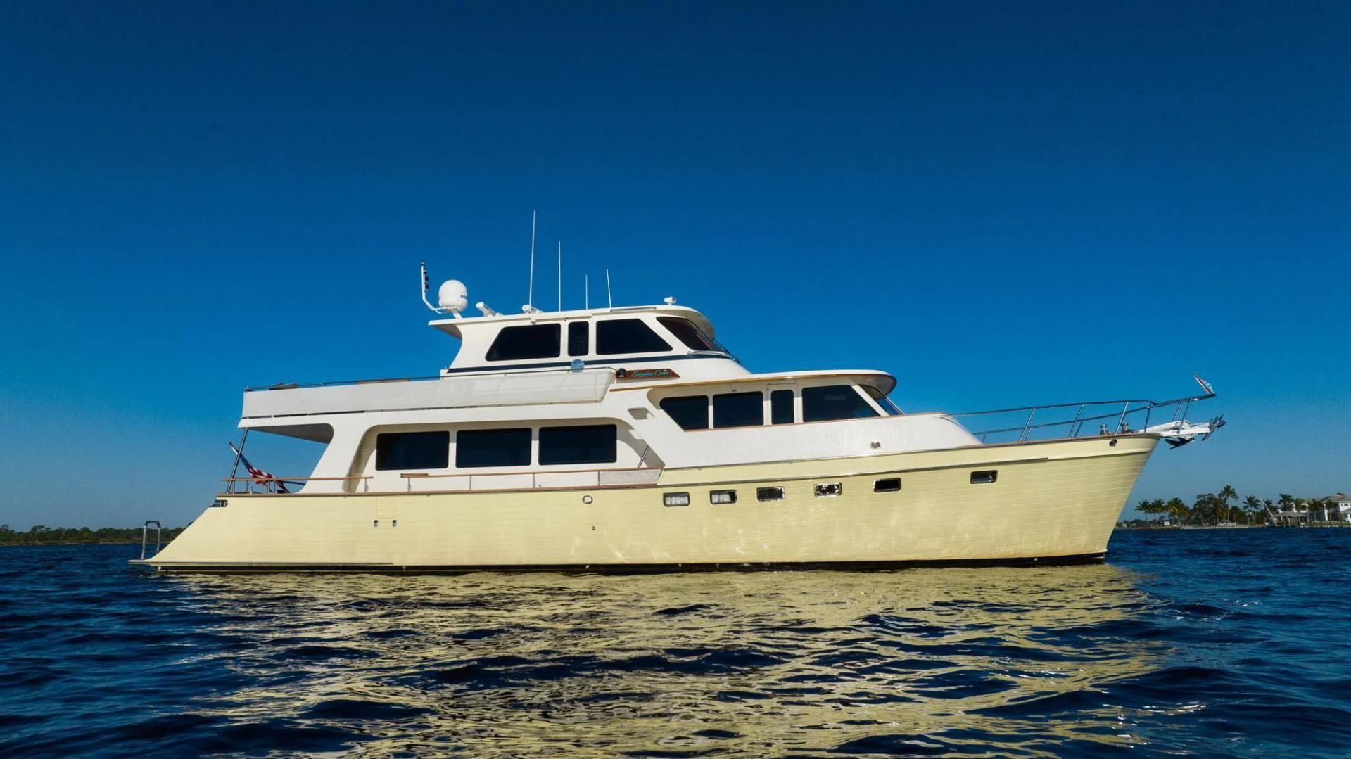 a white boat on the water aboard SOMEDAY CAME Yacht for Sale