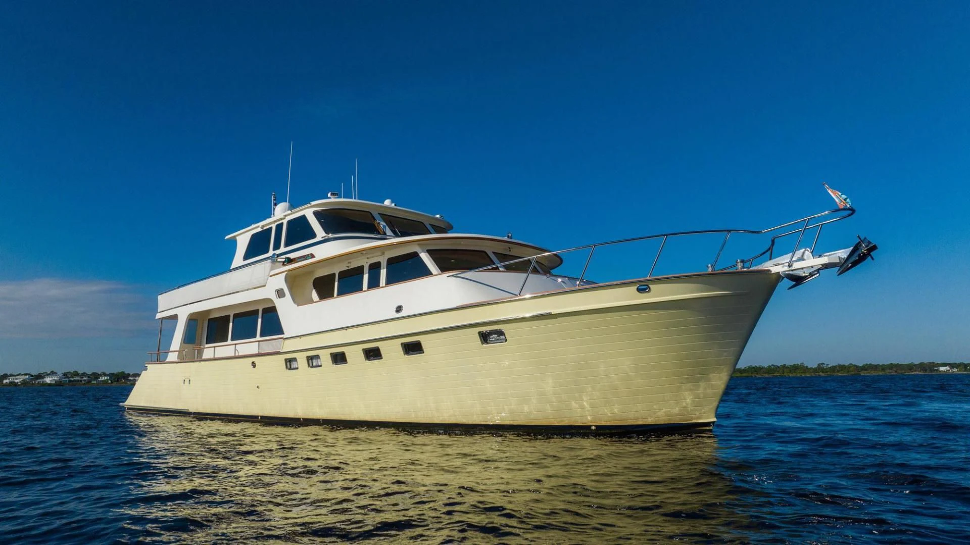 a white boat on the water aboard SOMEDAY CAME Yacht for Sale