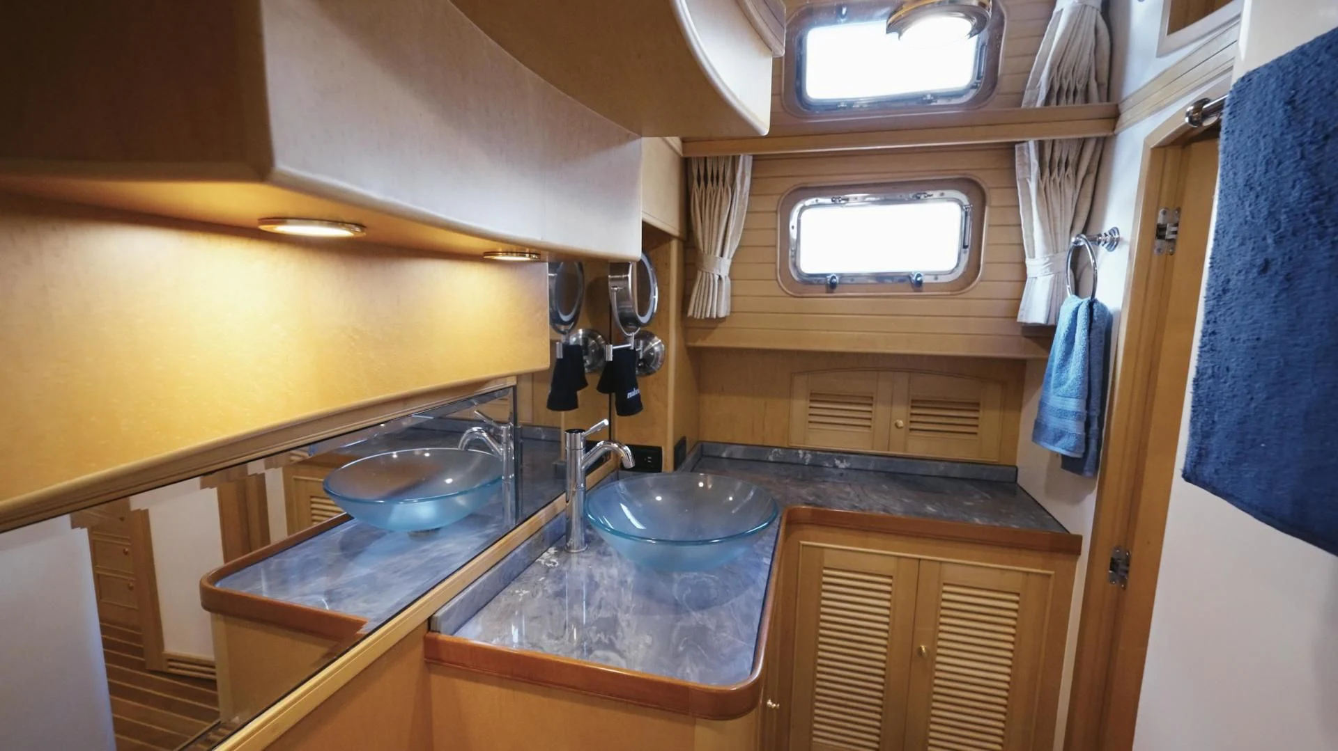a kitchen with a countertop sink and cabinets aboard SOMEDAY CAME Yacht for Sale