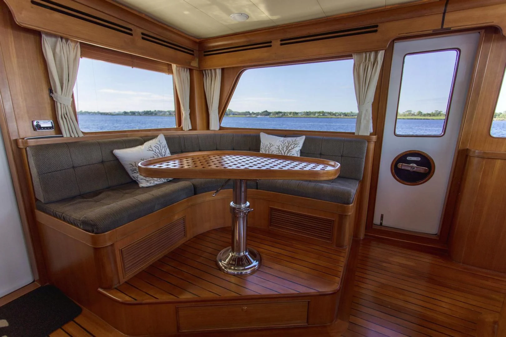 a living room with a couch and a table aboard SOMEDAY CAME Yacht for Sale