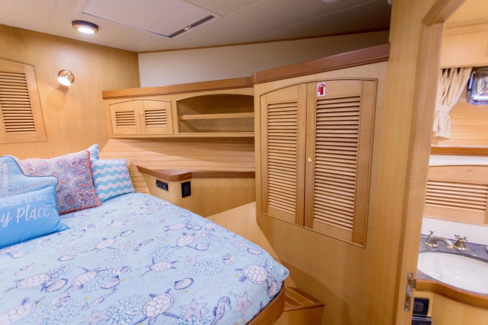 a bedroom with a bed and a window aboard SOMEDAY CAME Yacht for Sale
