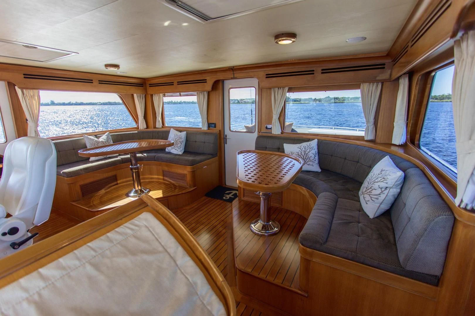 a living room with a couch and a table aboard SOMEDAY CAME Yacht for Sale