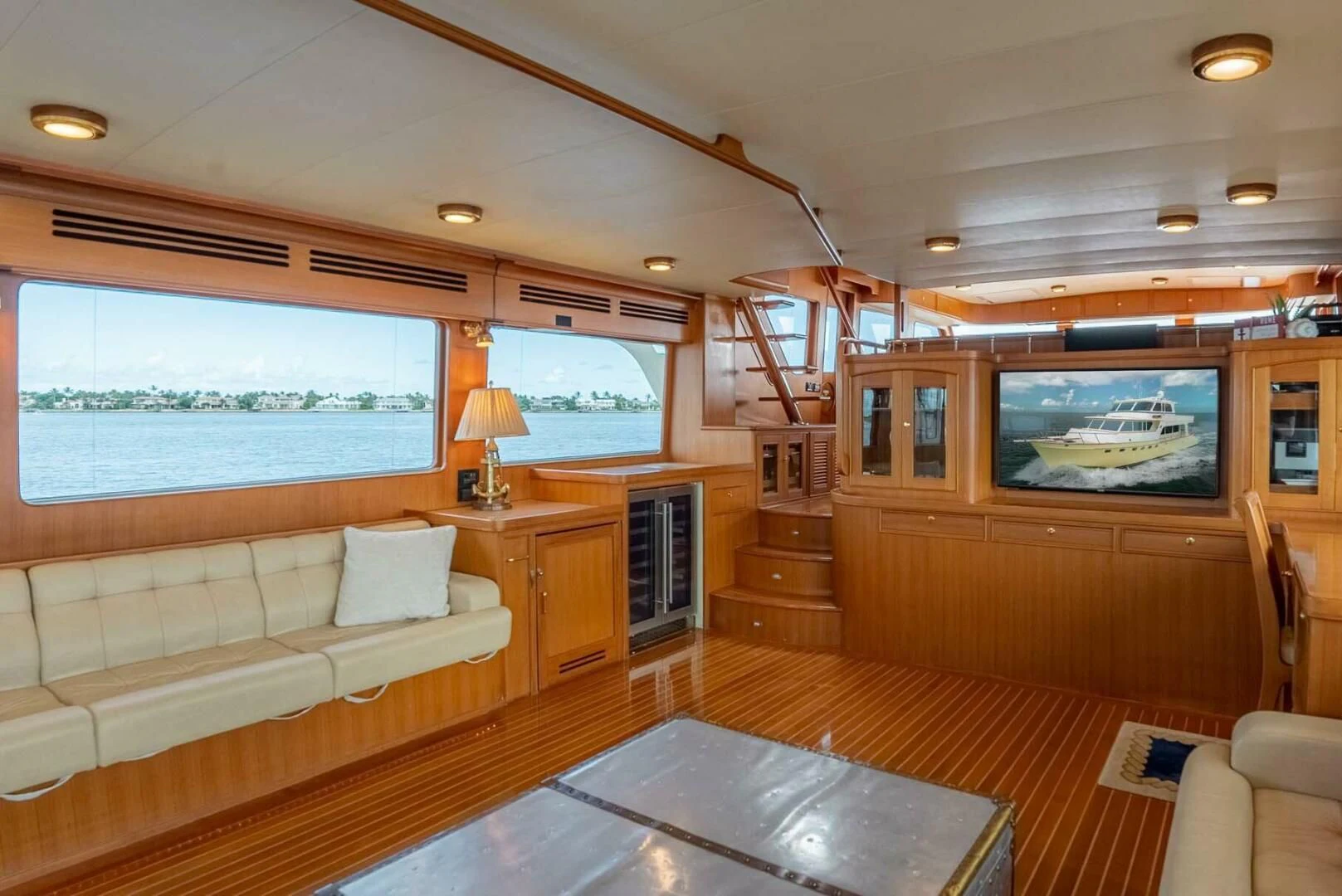 a living room with a large window aboard SOMEDAY CAME Yacht for Sale
