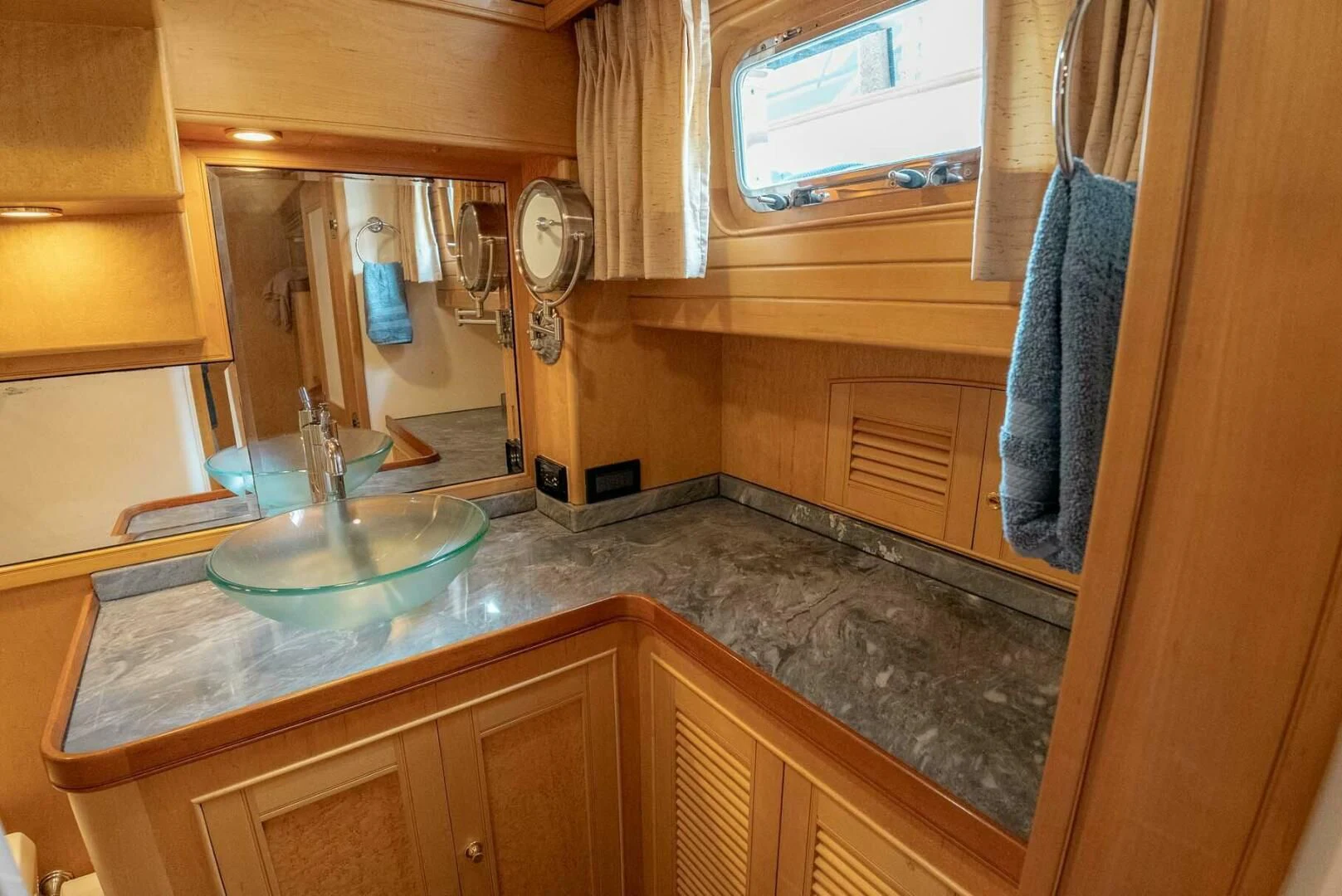 a bathroom with a sink and a mirror aboard SOMEDAY CAME Yacht for Sale