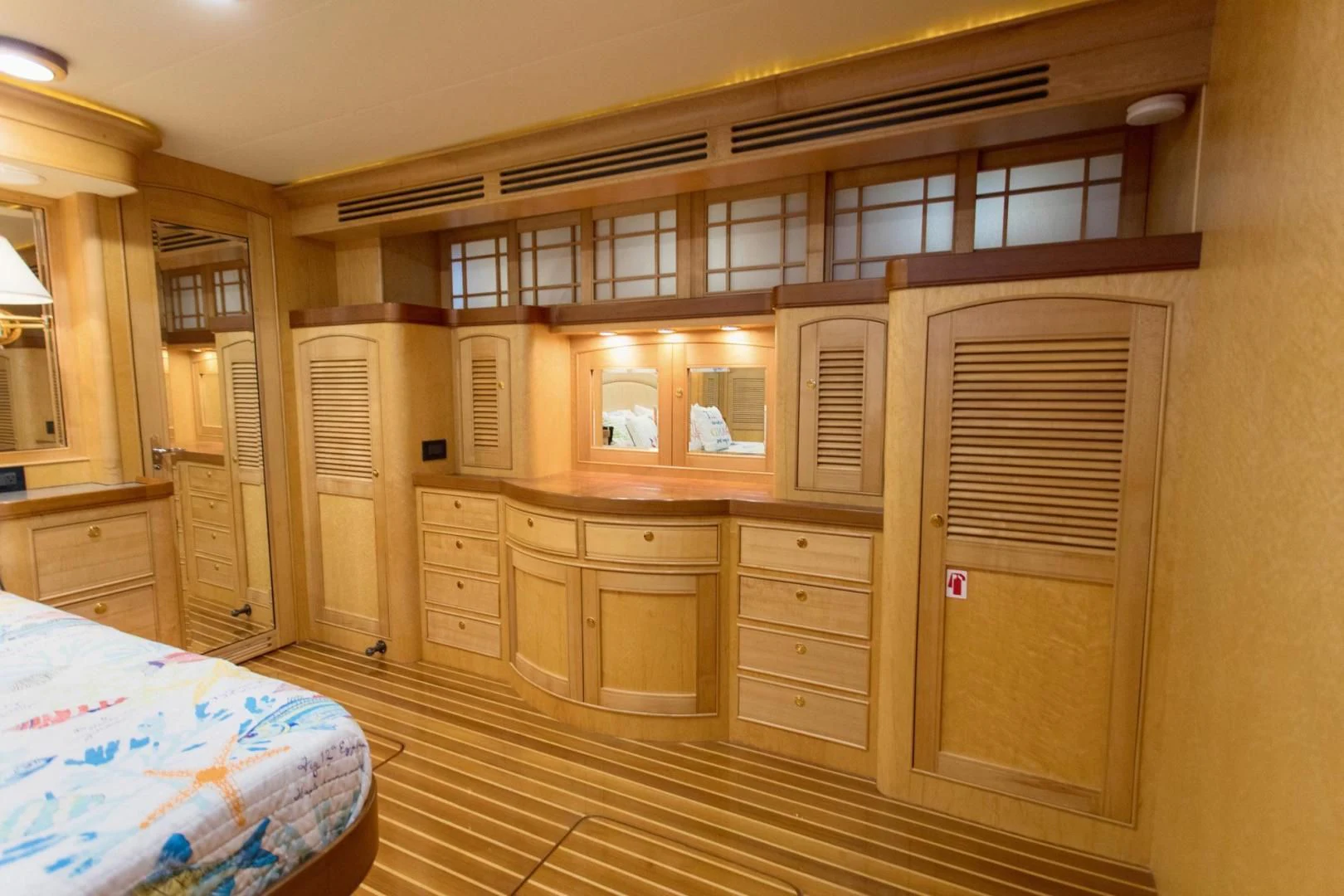 a bedroom with a bed and cabinets aboard SOMEDAY CAME Yacht for Sale