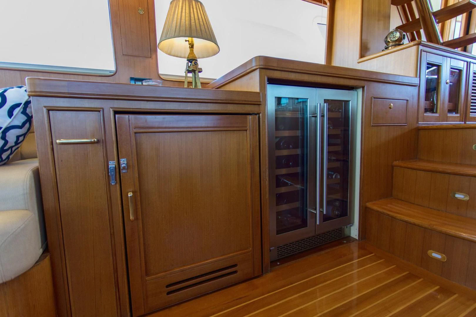 a wooden cabinet with a lamp on top of it aboard SOMEDAY CAME Yacht for Sale