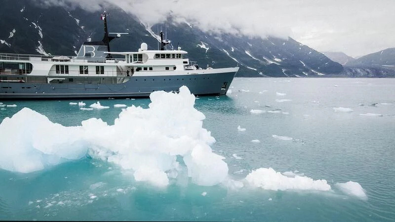 a large ship in the water aboard JUST B Yacht for Sale