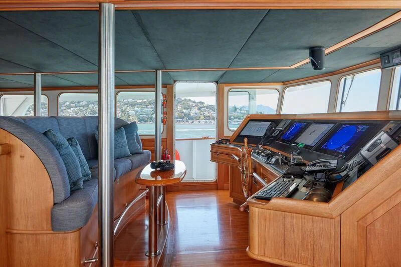 a train with a desk and a laptop aboard JUST B Yacht for Sale