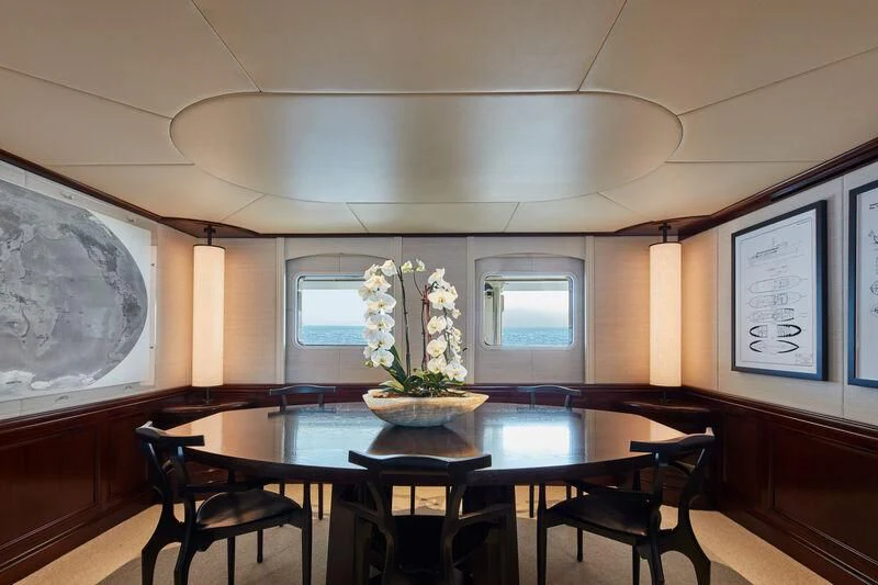 a dining table in a room aboard JUST B Yacht for Sale