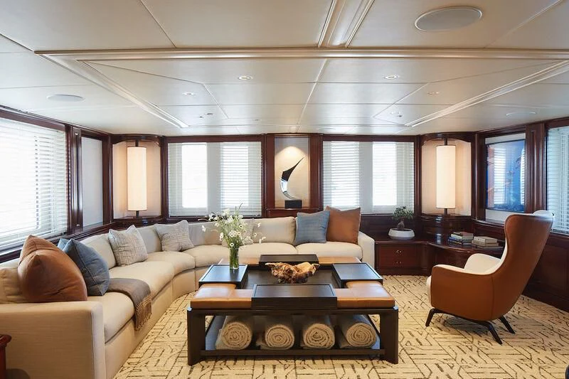 a living room with a couch and a coffee table aboard JUST B Yacht for Sale