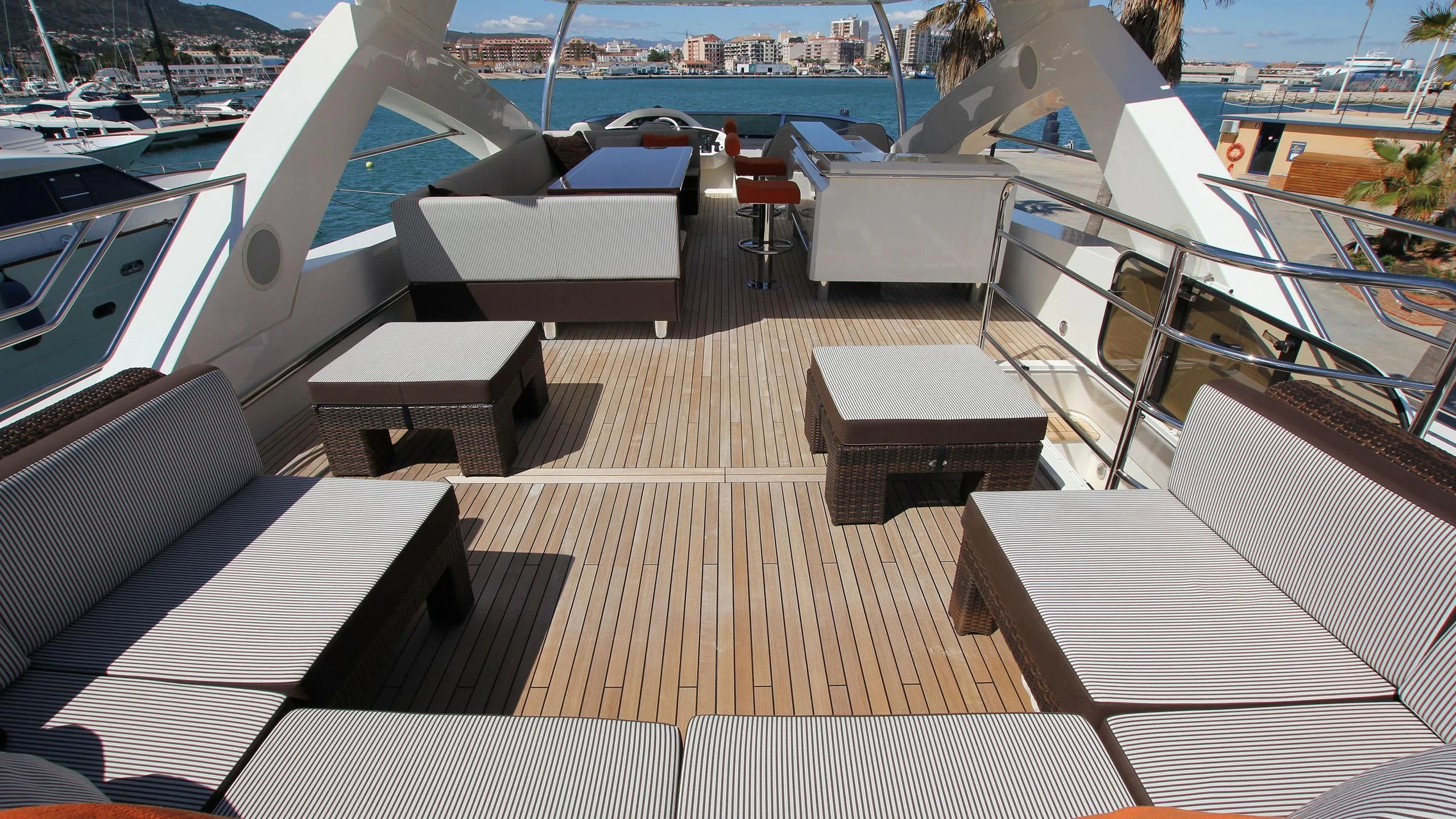 a deck with a view of the water and boats aboard E&E Yacht for Sale