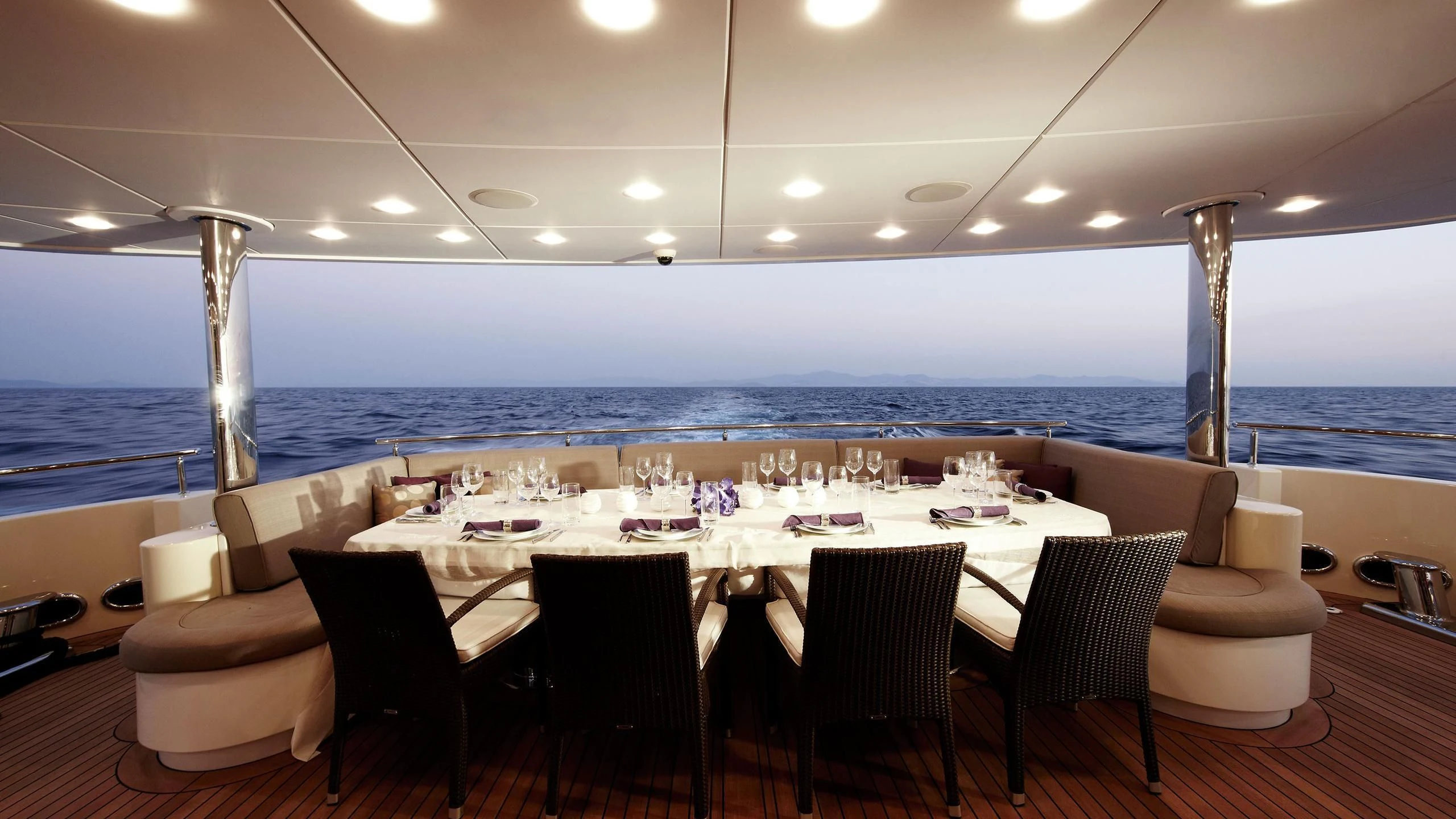 a room with a table and chairs aboard E&E Yacht for Sale