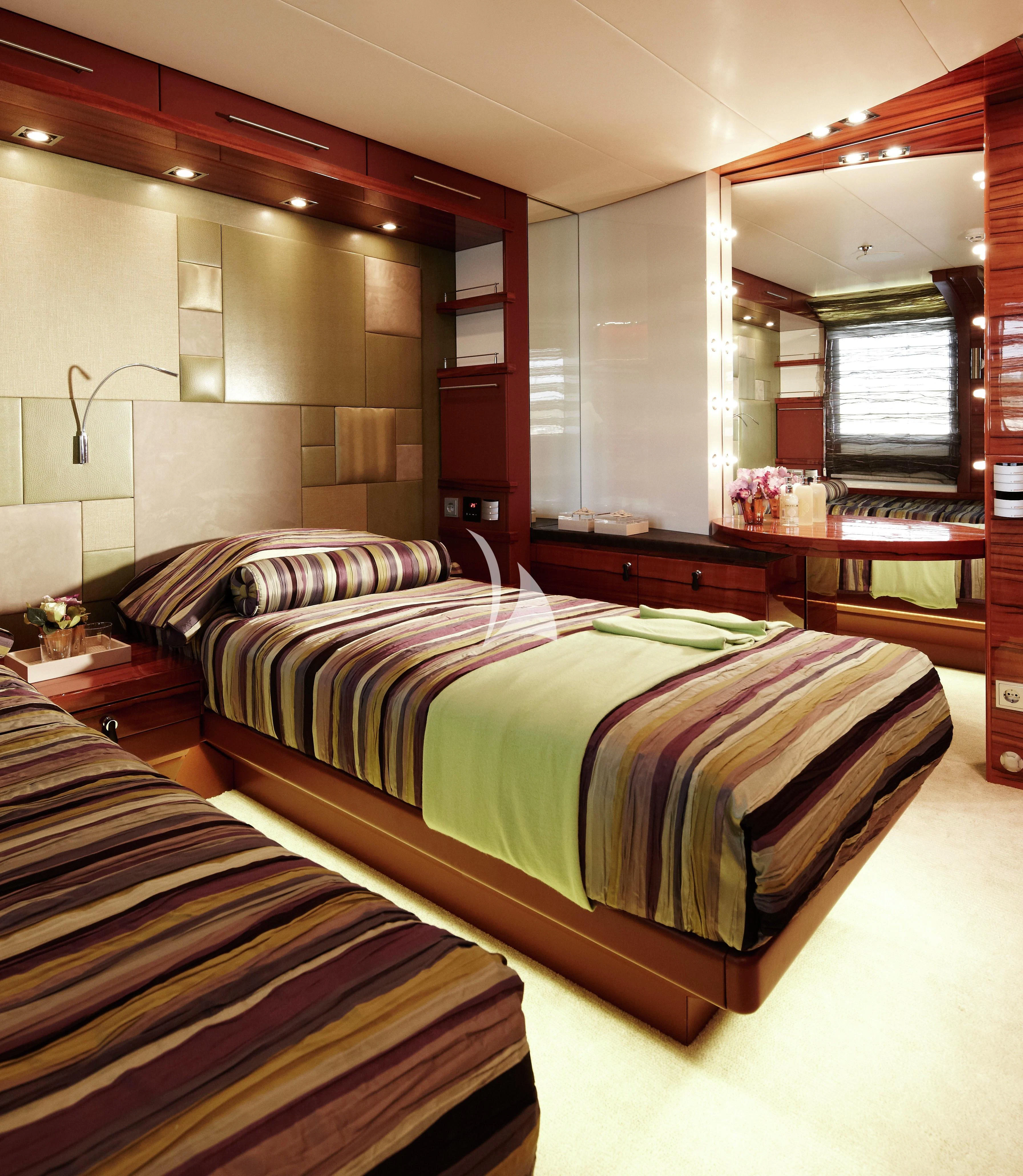 a room with a bed and a mirror aboard E&E Yacht for Sale