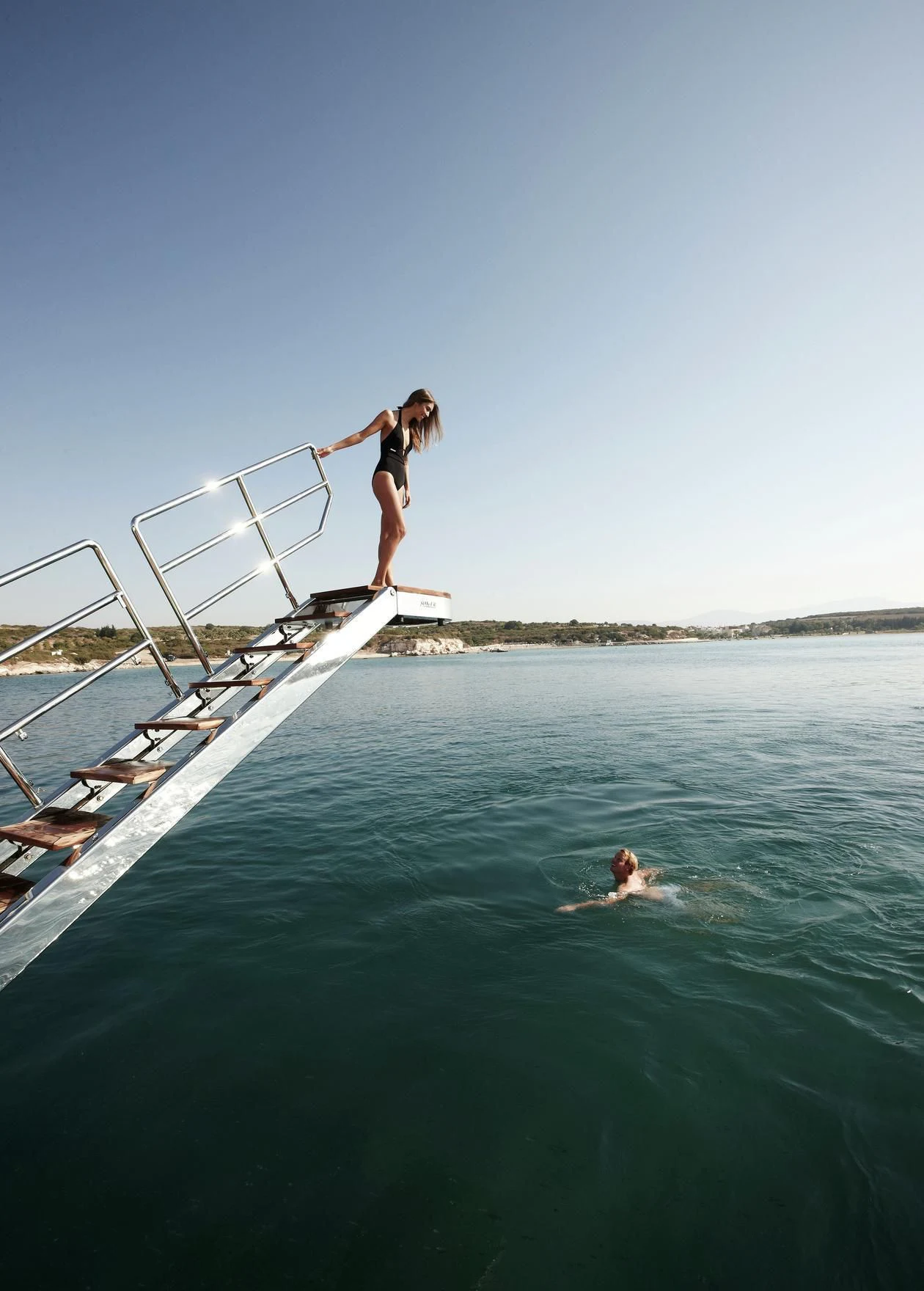 a man standing on a boat aboard E&E Yacht for Sale