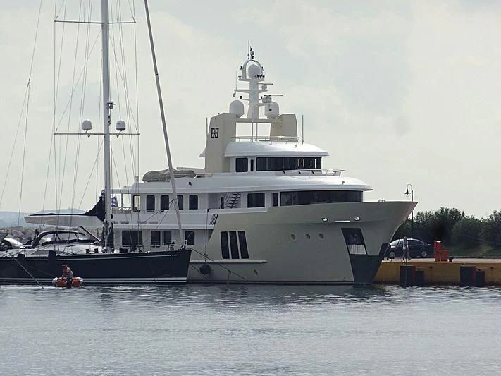 a large white boat with a smaller boat in it aboard E&E Yacht for Sale