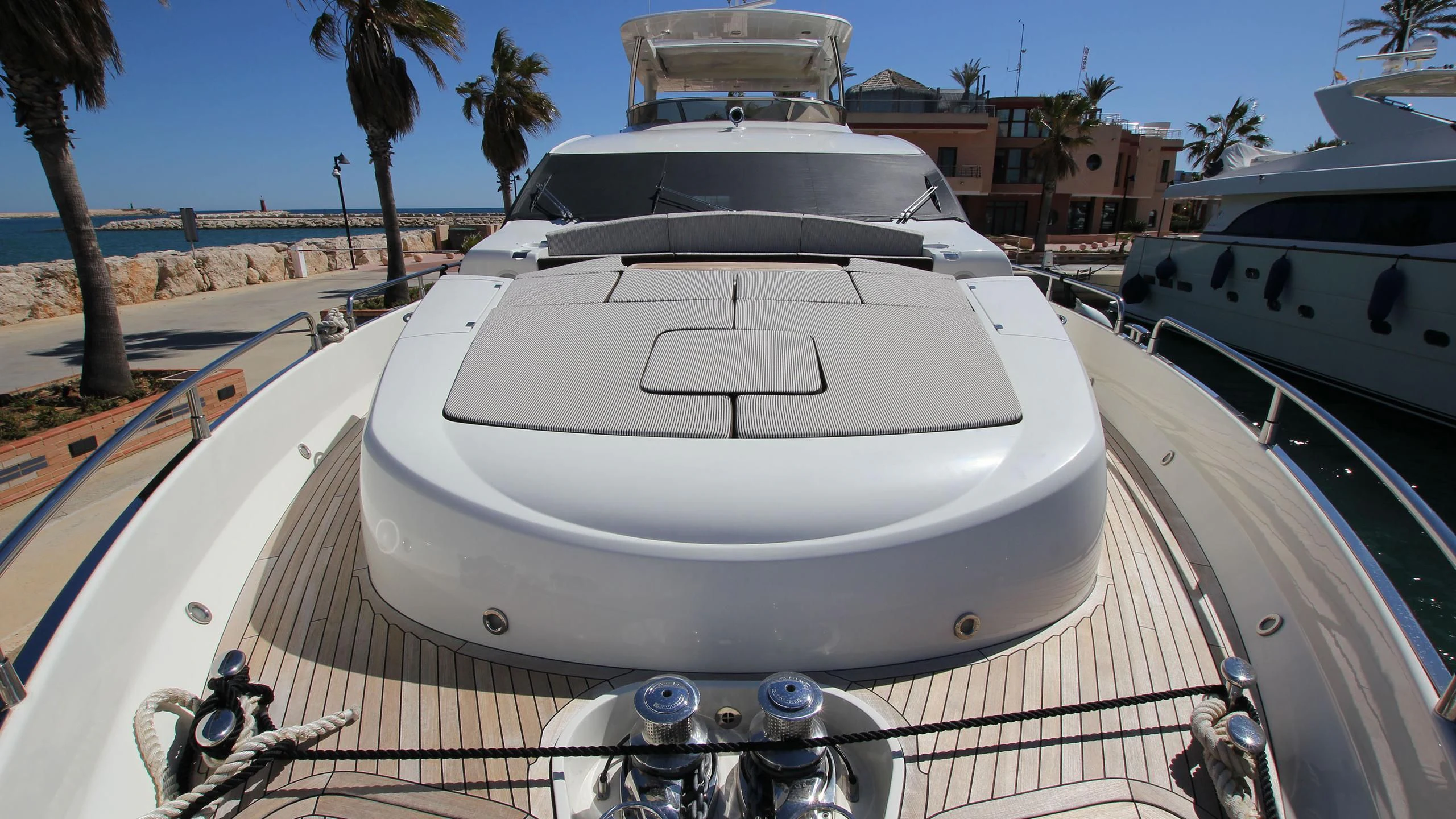 a white yacht on a deck aboard E&E Yacht for Sale