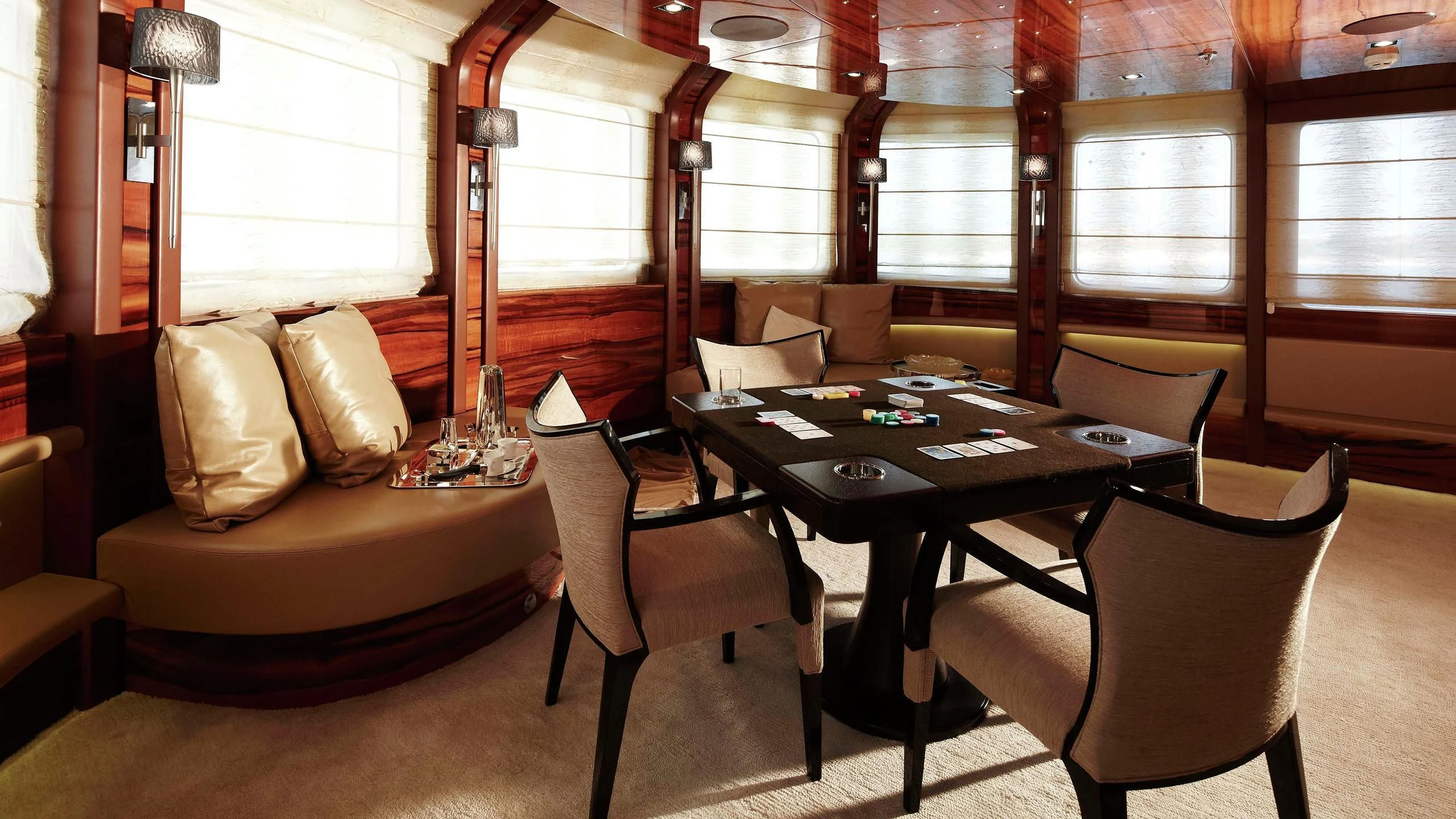 a room with a table and chairs aboard E&E Yacht for Sale