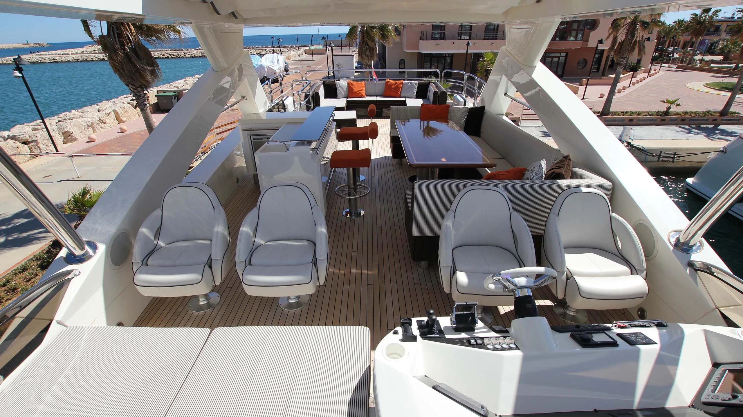a boat with chairs and tables aboard E&E Yacht for Sale