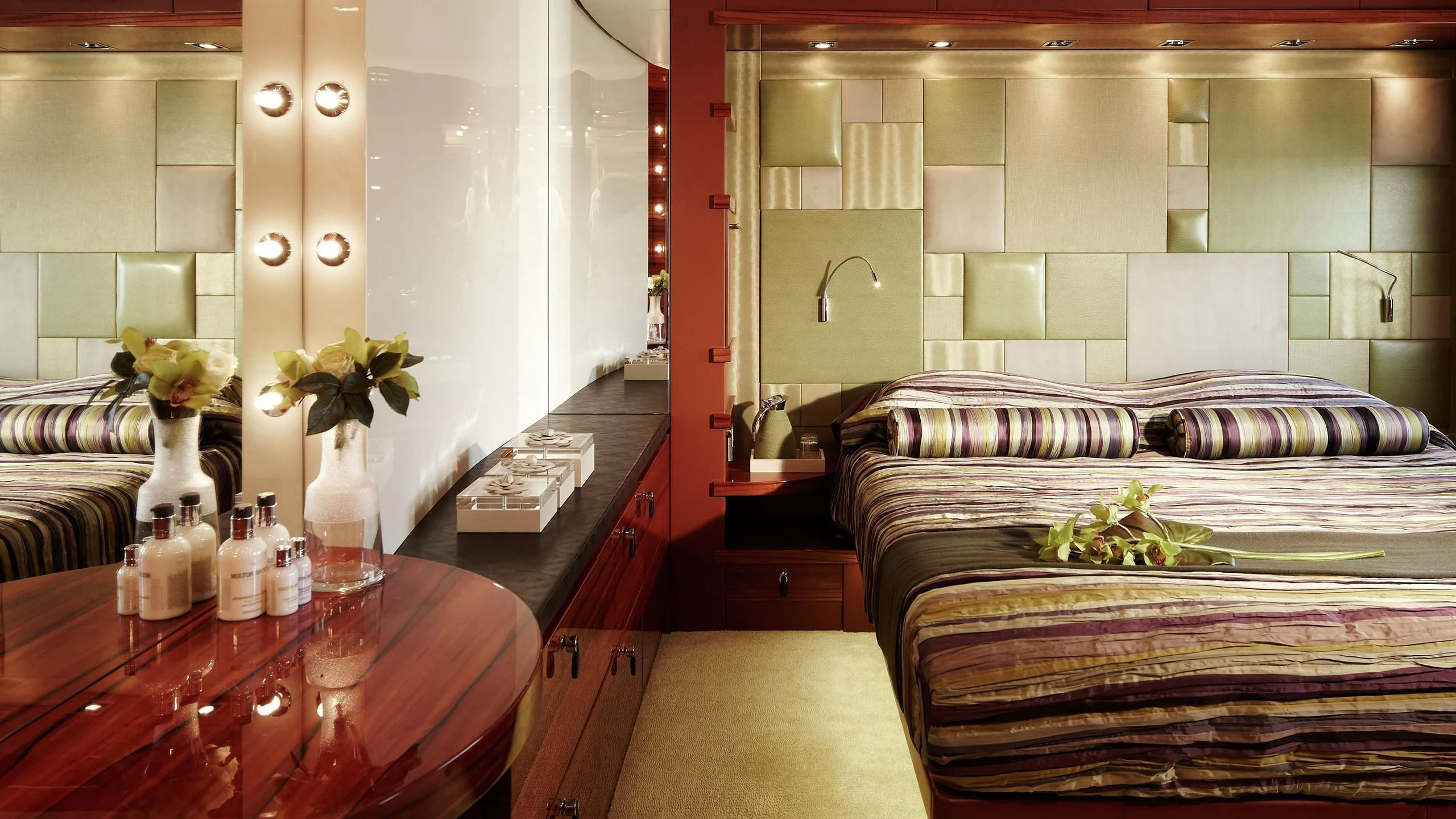 a bedroom with a bed and a table aboard E&E Yacht for Sale