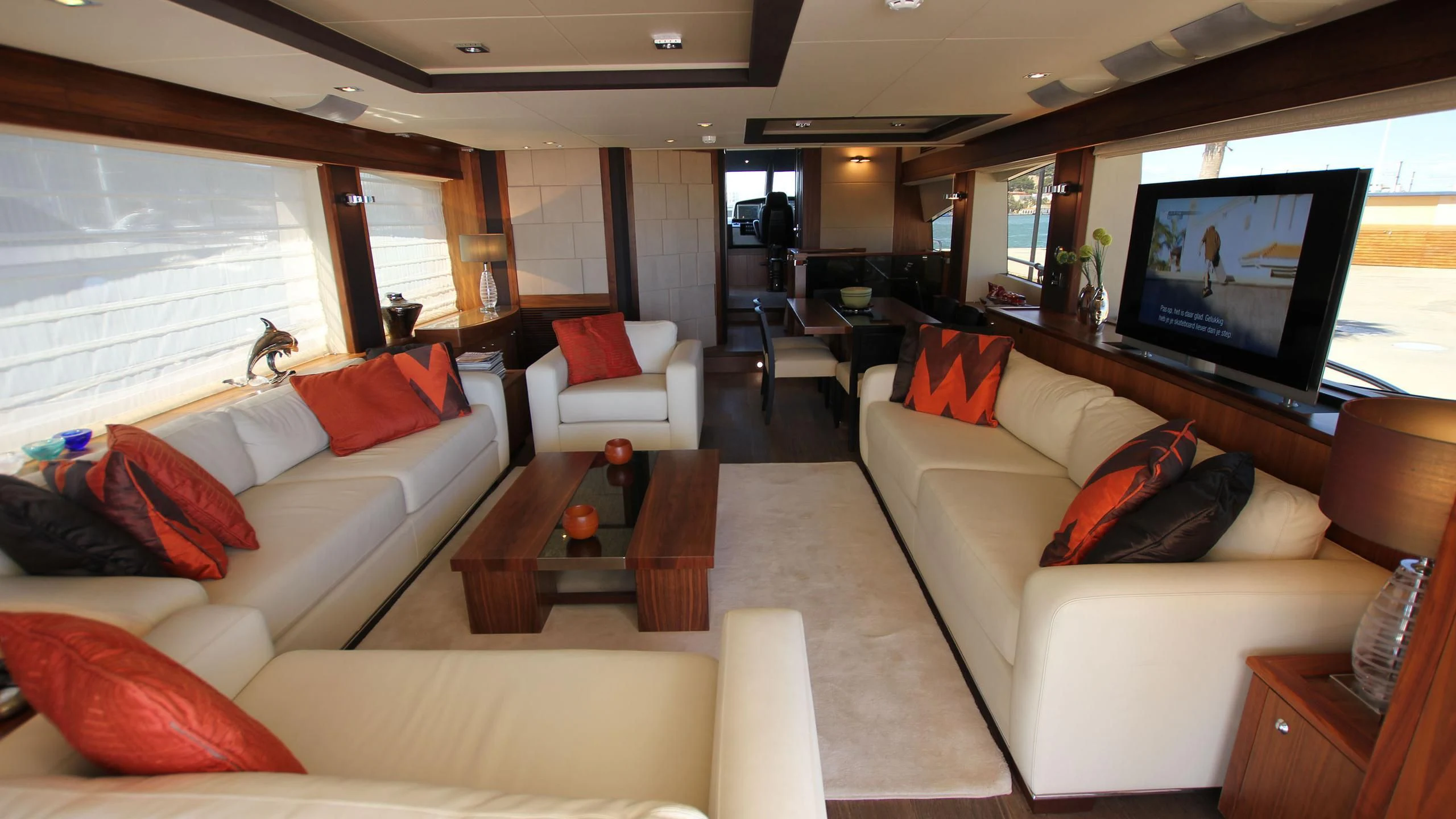 a living room with a large screen aboard E&E Yacht for Sale