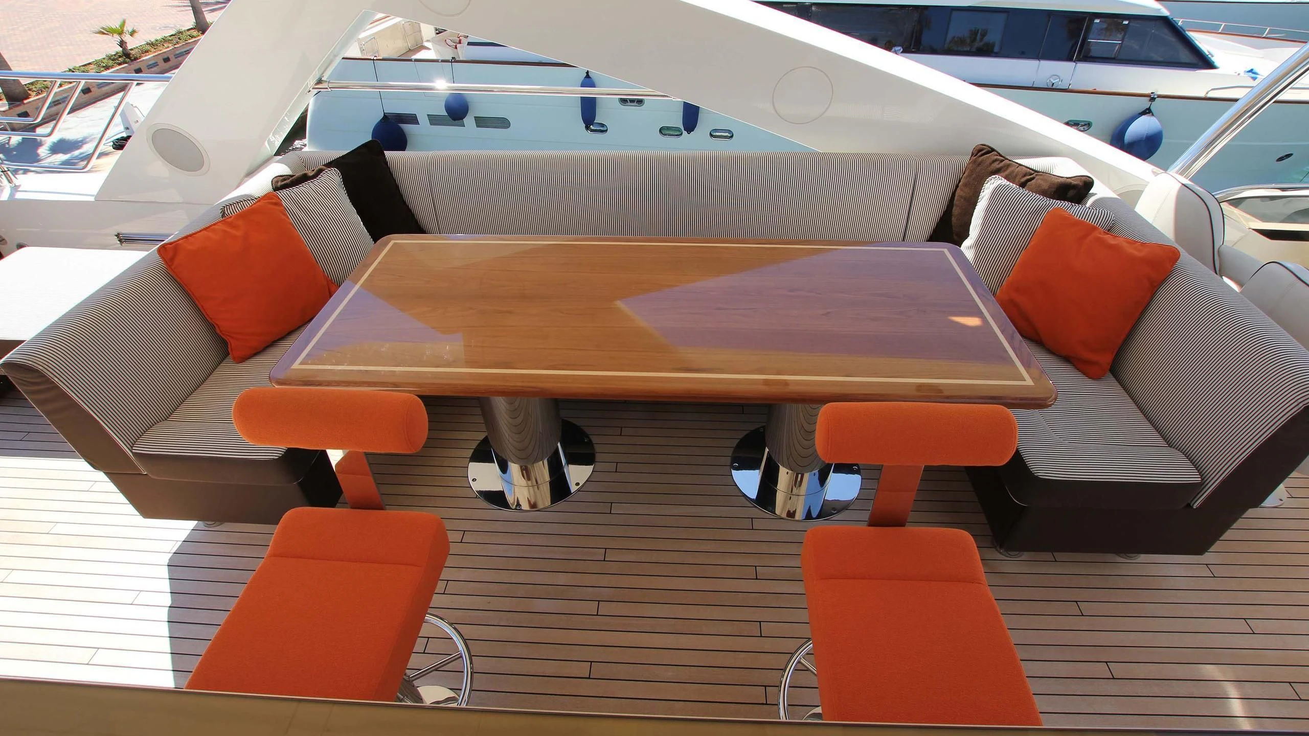a wooden table with chairs around it aboard E&E Yacht for Sale