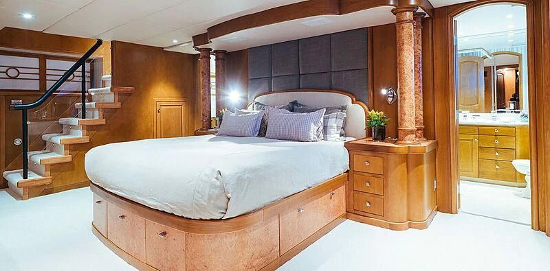 a large bed in a room aboard DAYDREAM Yacht for Sale