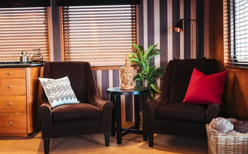 a living room with a couch and a coffee table aboard DAYDREAM Yacht for Sale