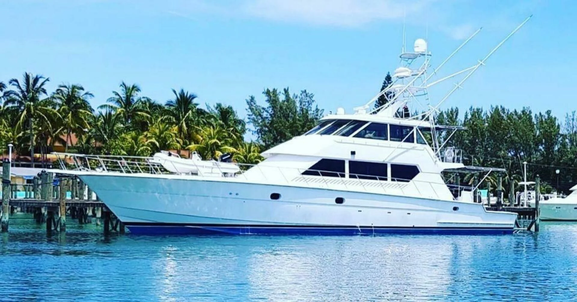 a large white boat in a body of water aboard MAHA Yacht for Sale