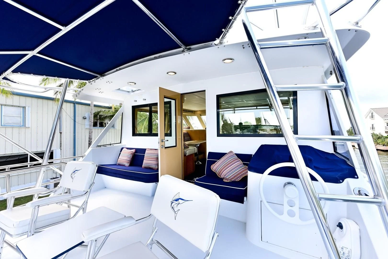 a boat with a deck and chairs aboard MAHA Yacht for Sale