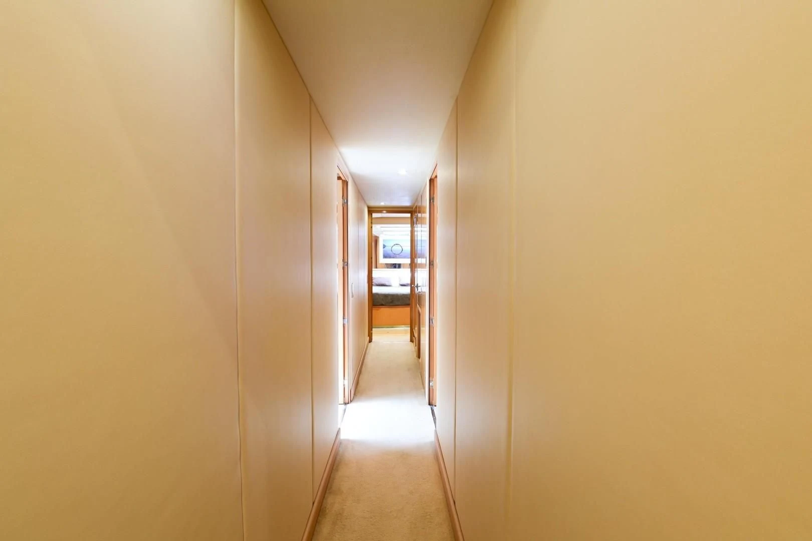 a hallway with doors aboard MAHA Yacht for Sale