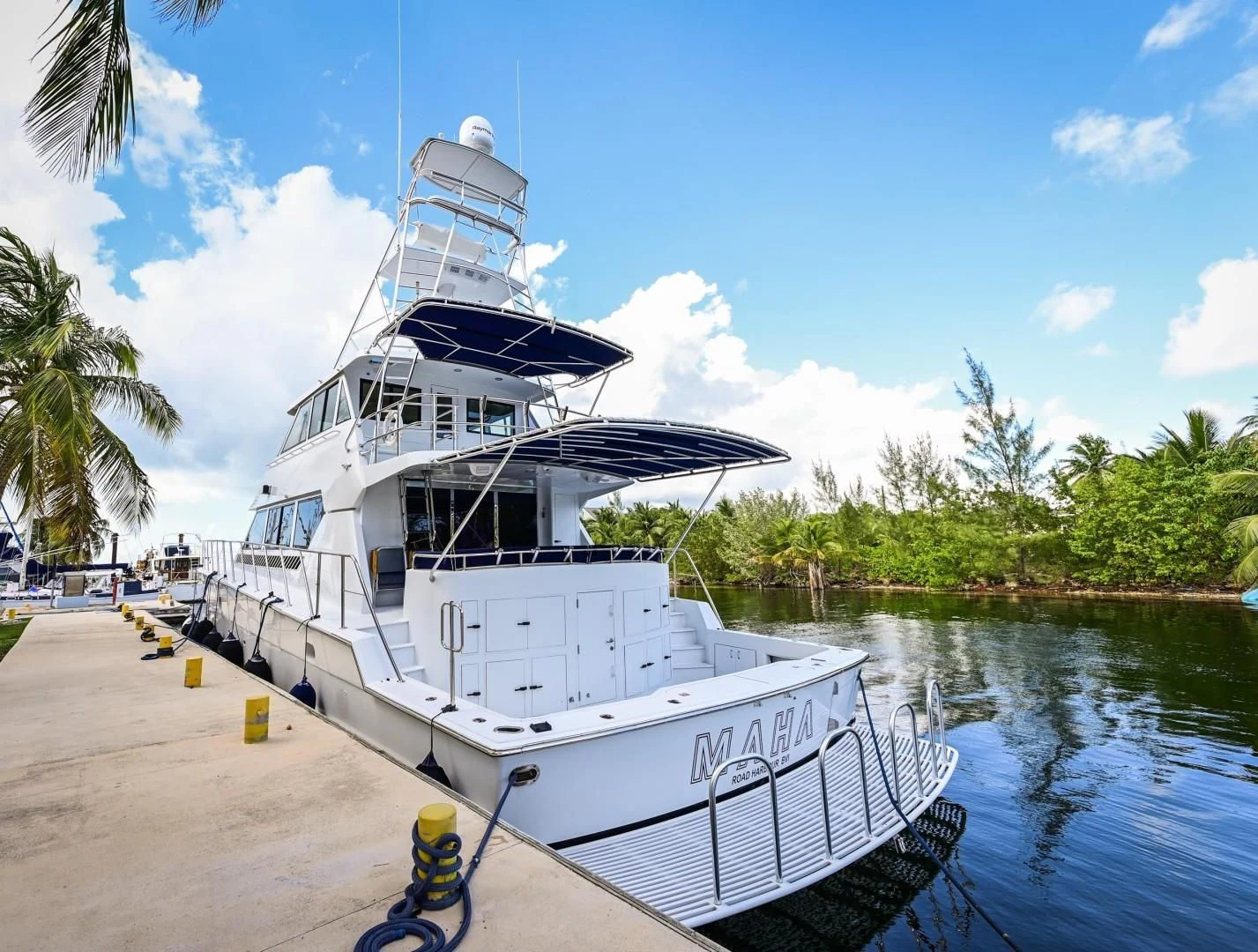 a boat docked at a pier aboard MAHA Yacht for Sale