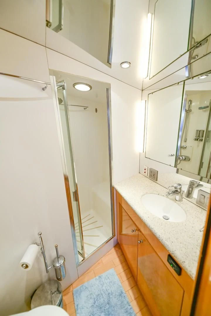 a bathroom with a sink and a shower aboard MAHA Yacht for Sale