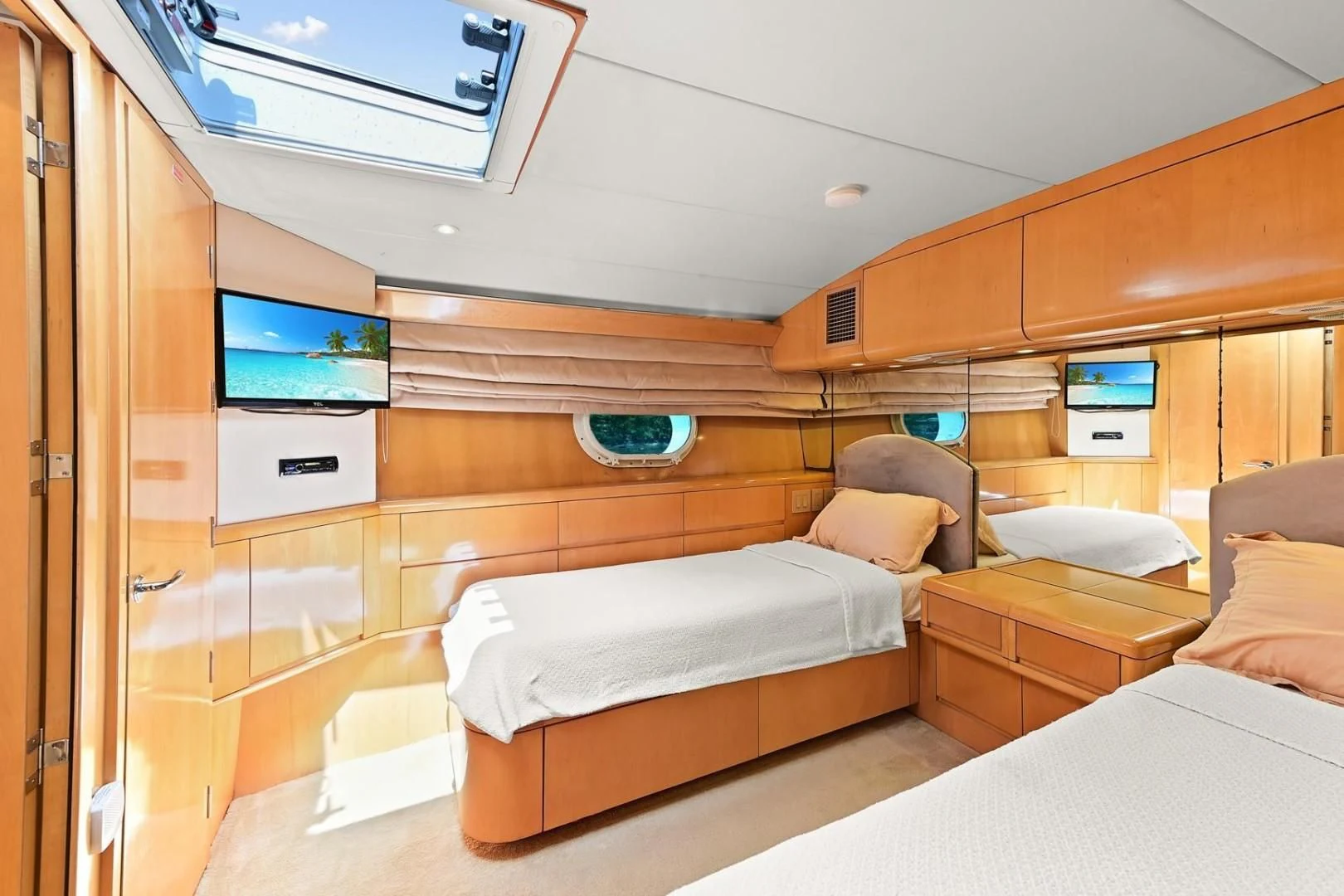 a room with a bed and a tv aboard MAHA Yacht for Sale