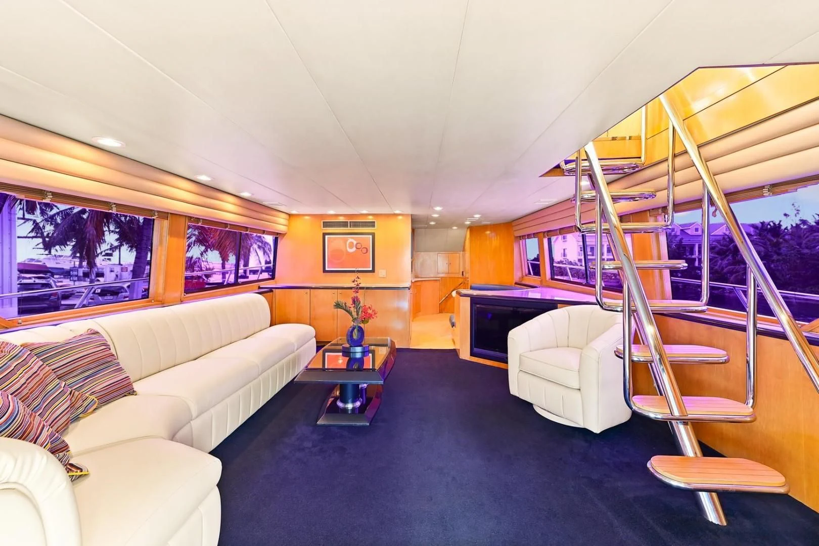 a room with a bunk bed and couches aboard MAHA Yacht for Sale