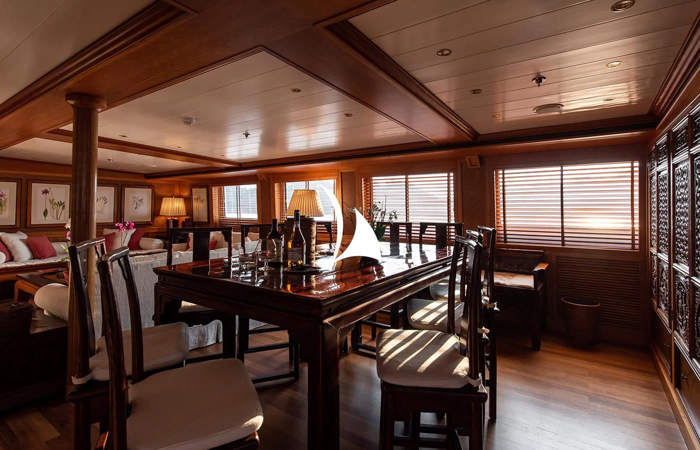 a bar with a table and chairs aboard BLEU DE NIMES Yacht for Charter