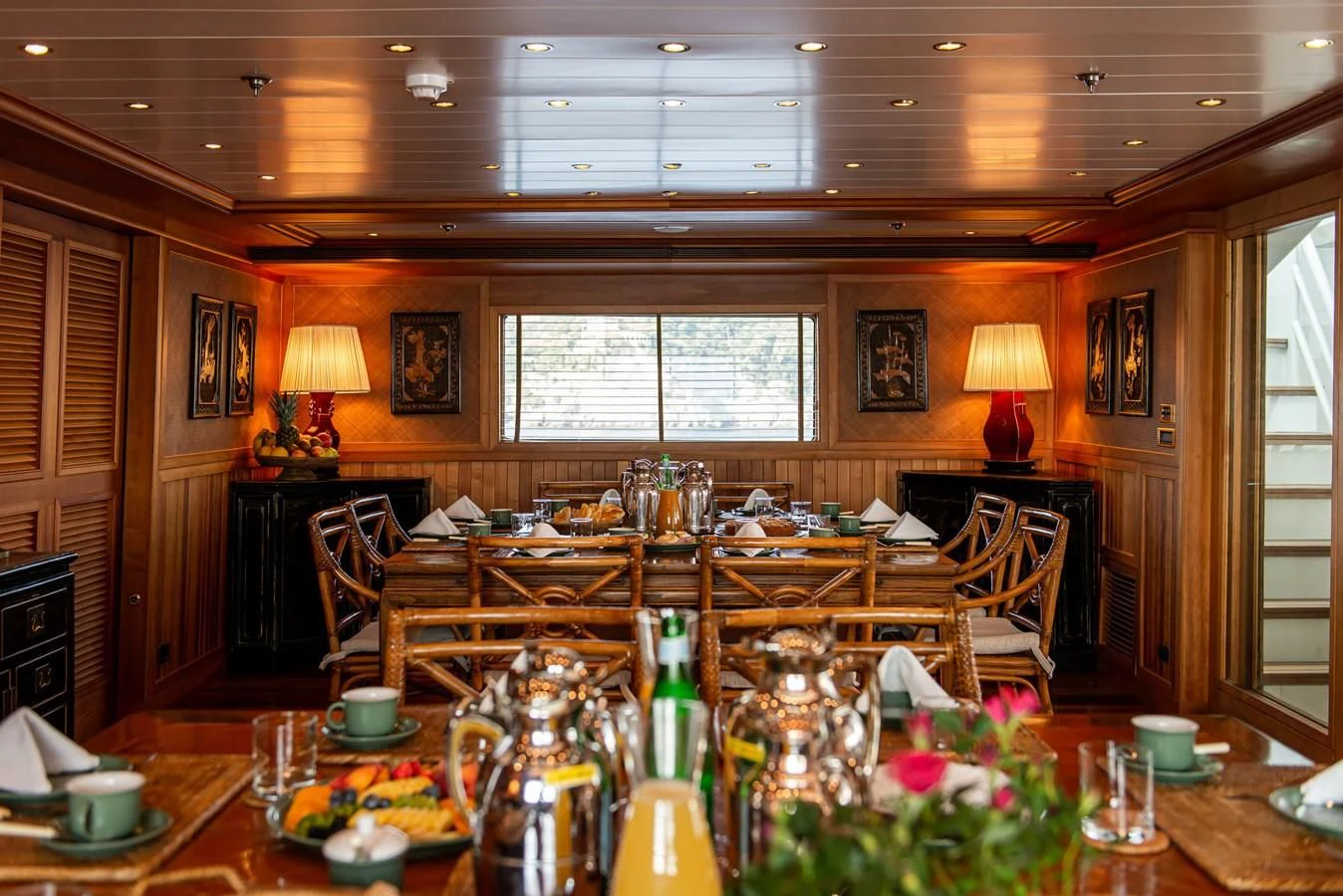 a dining room with a table and chairs aboard BLEU DE NIMES Yacht for Charter