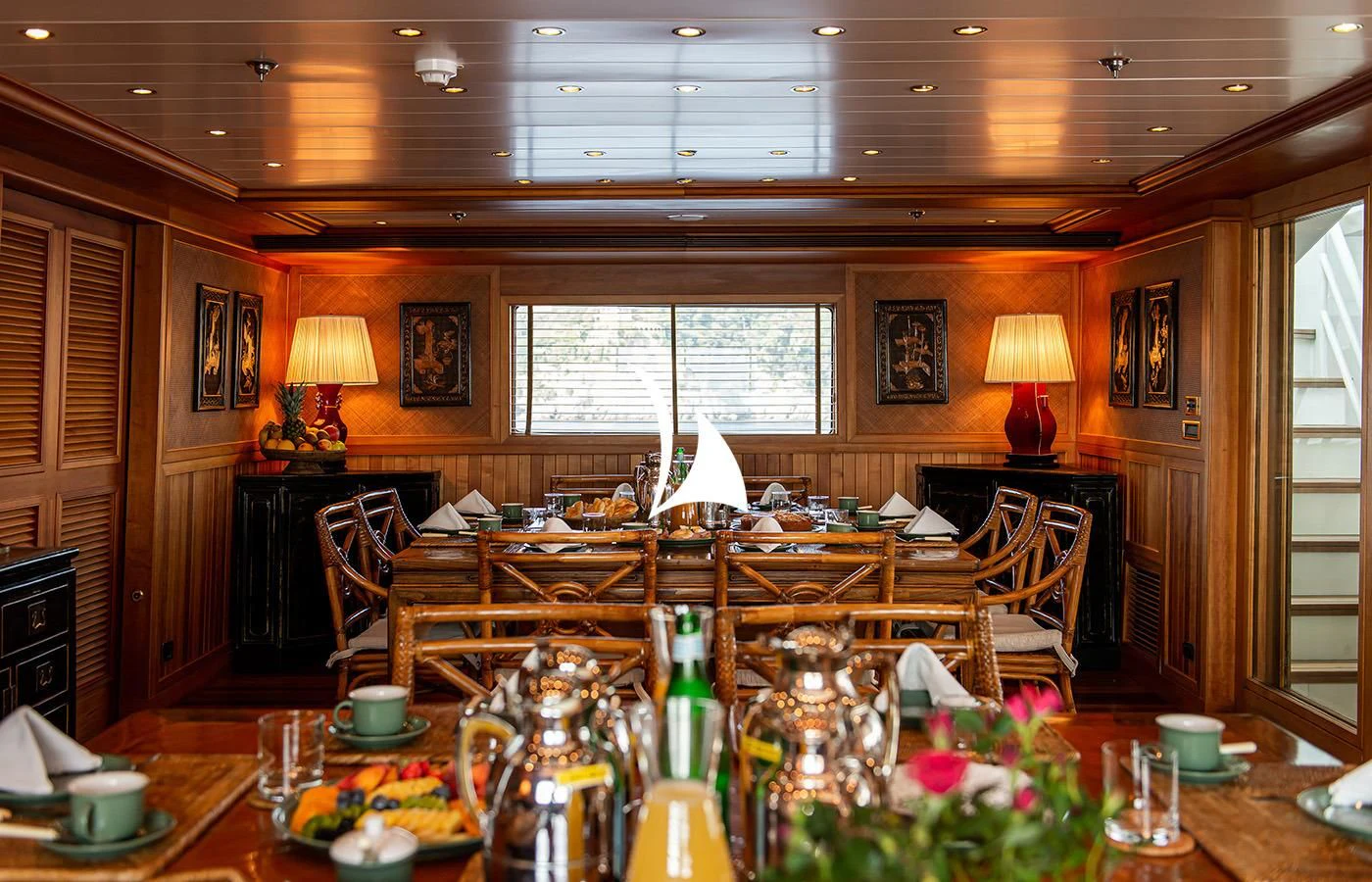 a room with a table and chairs aboard BLEU DE NIMES Yacht for Charter