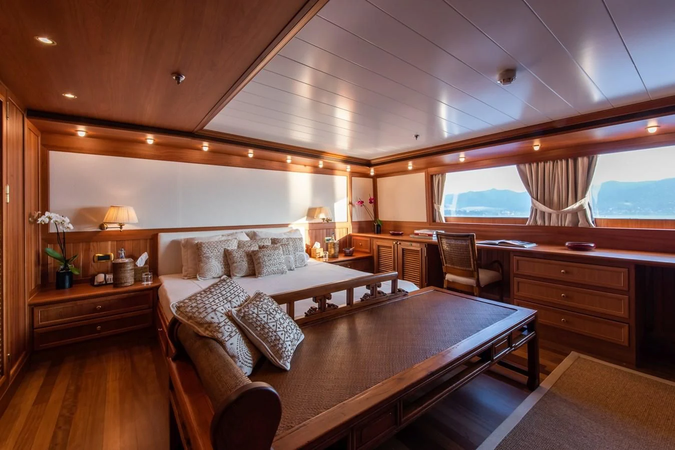 a living room with a large window aboard BLEU DE NIMES Yacht for Charter