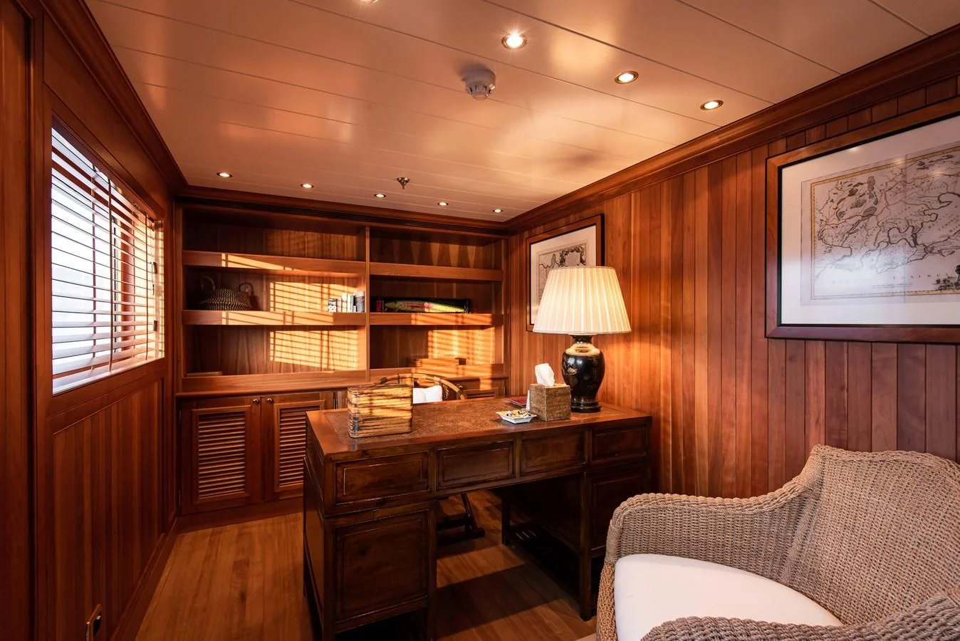a room with a desk and a bed aboard BLEU DE NIMES Yacht for Charter