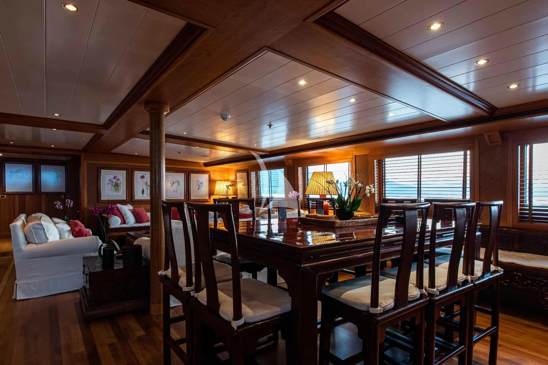 a dining room with a table and chairs aboard BLEU DE NIMES Yacht for Charter