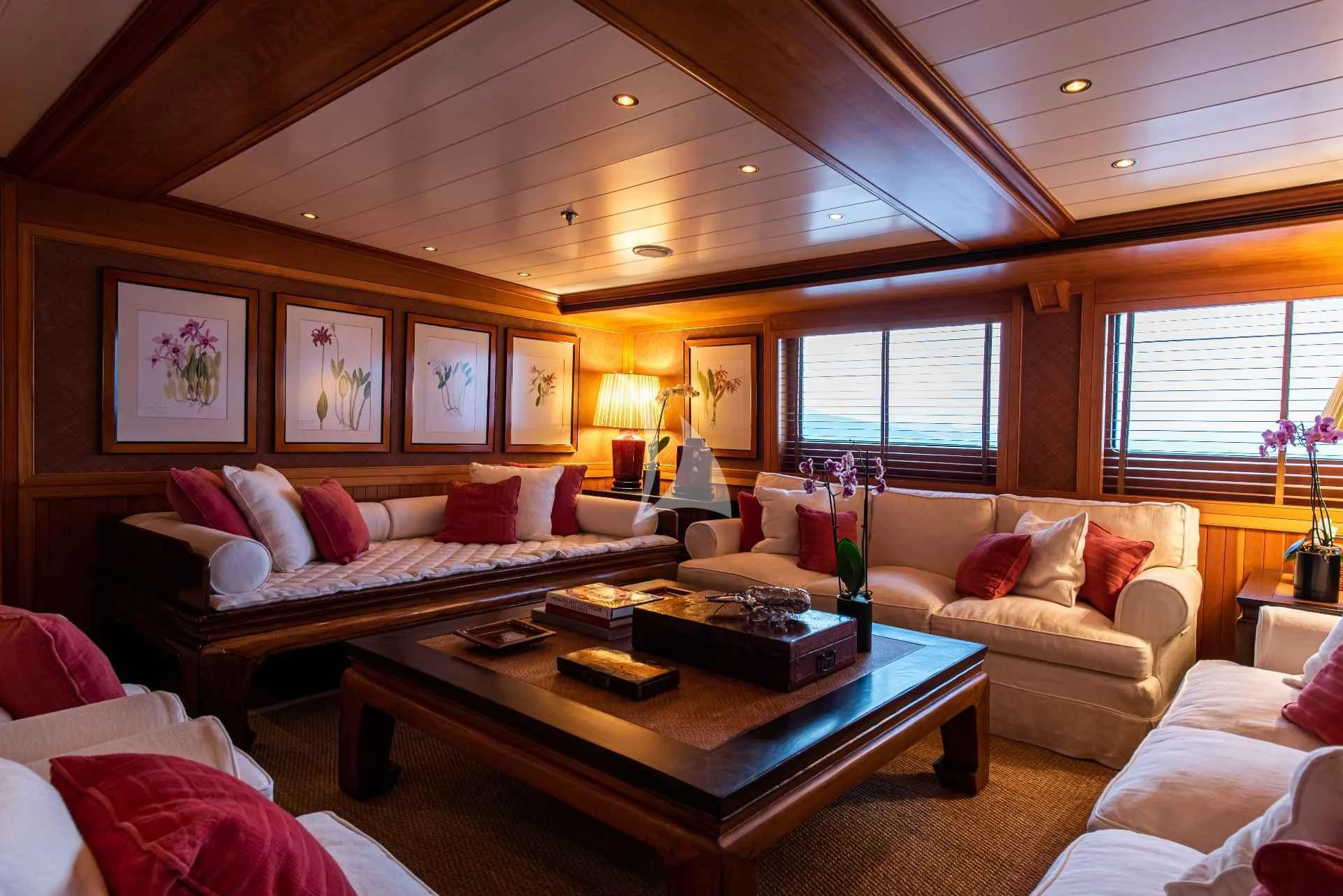 a living room with a large bed aboard BLEU DE NIMES Yacht for Charter