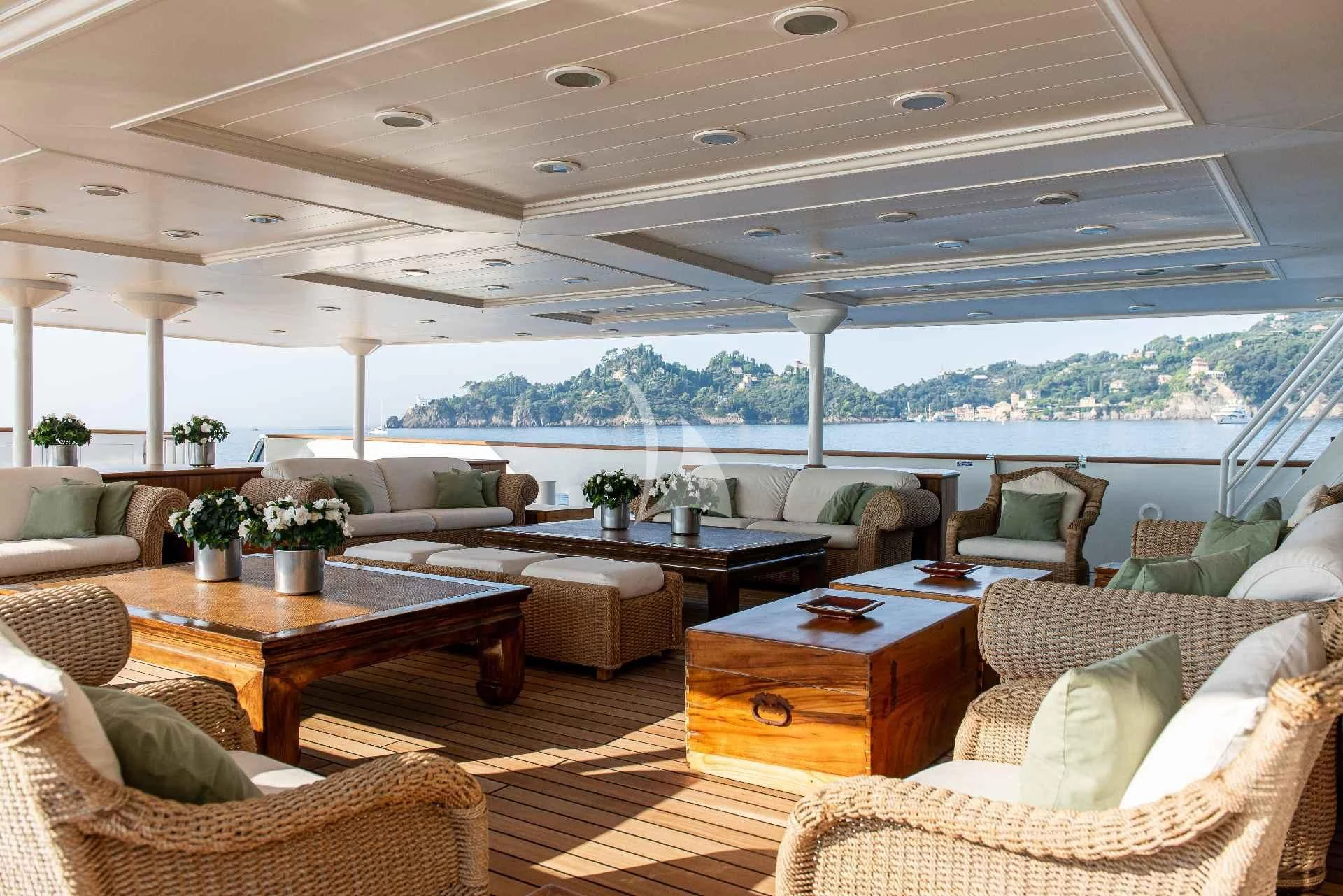 a living room with a large balcony aboard BLEU DE NIMES Yacht for Charter