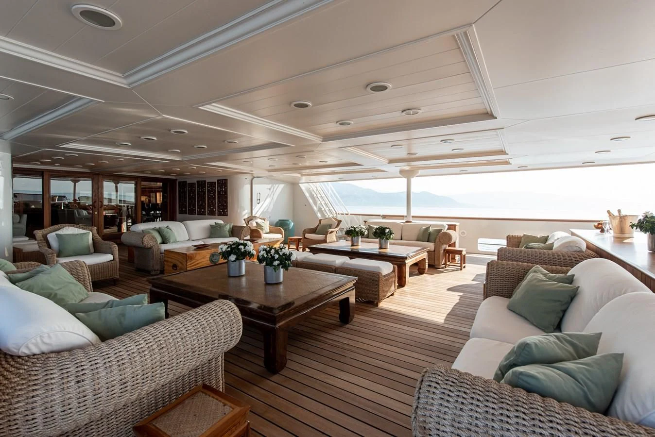 a living room with a large window aboard BLEU DE NIMES Yacht for Charter