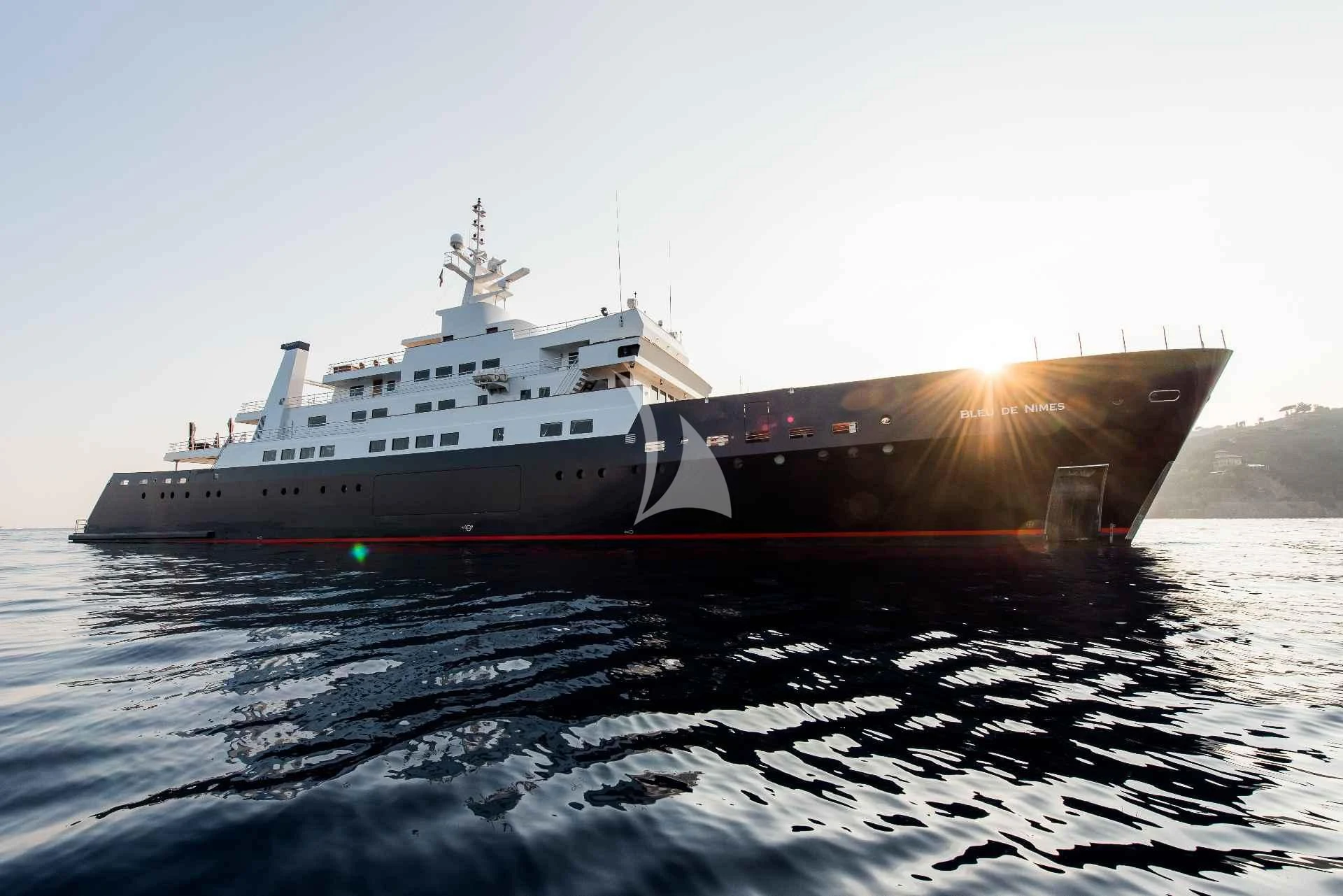 a large ship in the water aboard BLEU DE NIMES Yacht for Charter